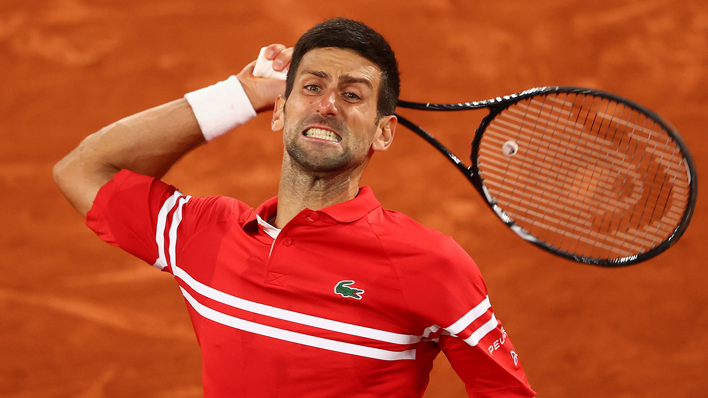 Novak Djokovic of Serbia celebrates match point and victory during his Mens Singles Quarter-Final match against Matteo Berrettini of Italy at Roland-Garros.