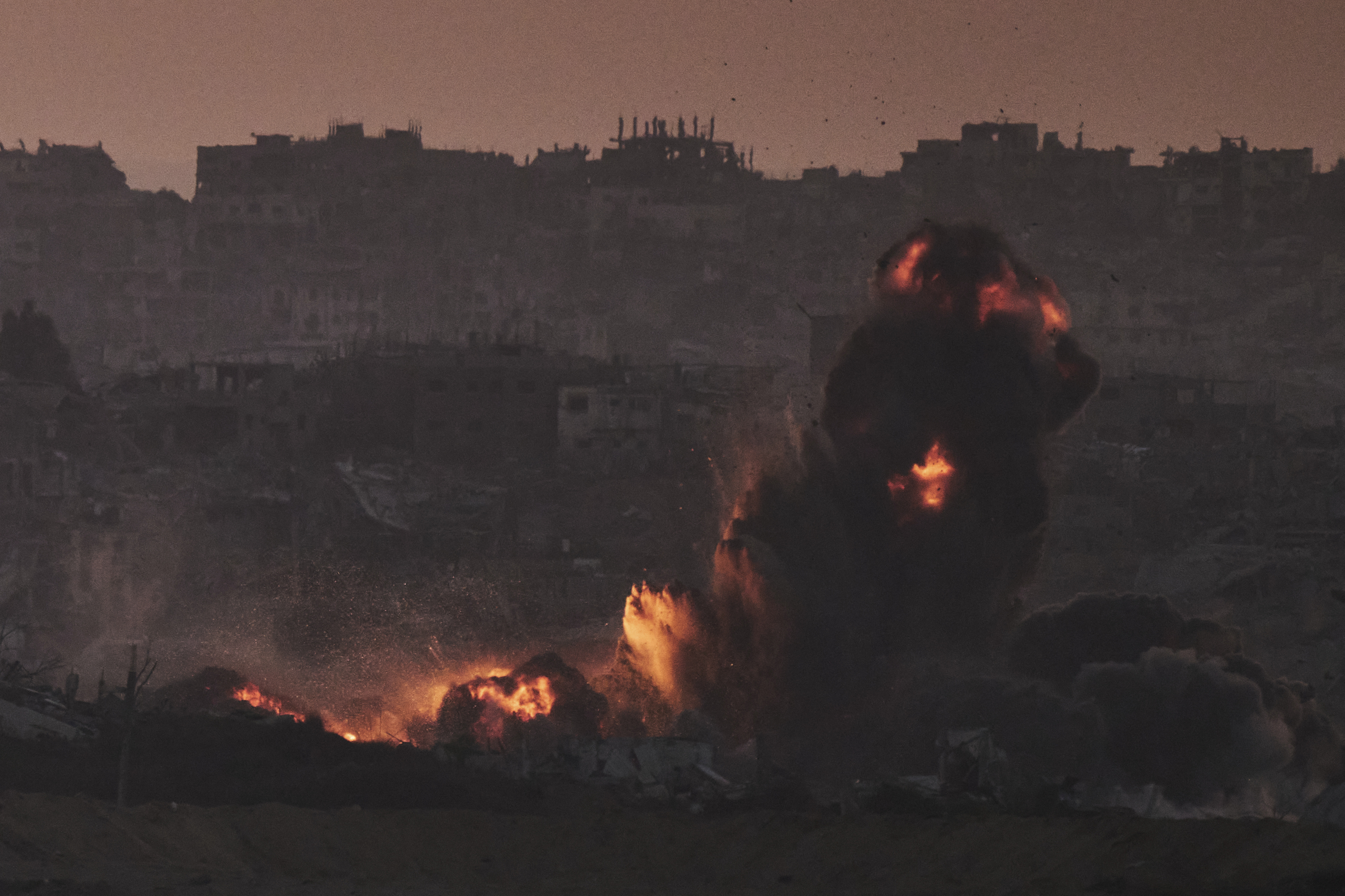 Smoke and fire rise to the sky following an Israeli airstrike in the northern Gaza Strip, as seen from southern Israel, Friday, July 18, 2025. (AP Photo/Leo Correa)
