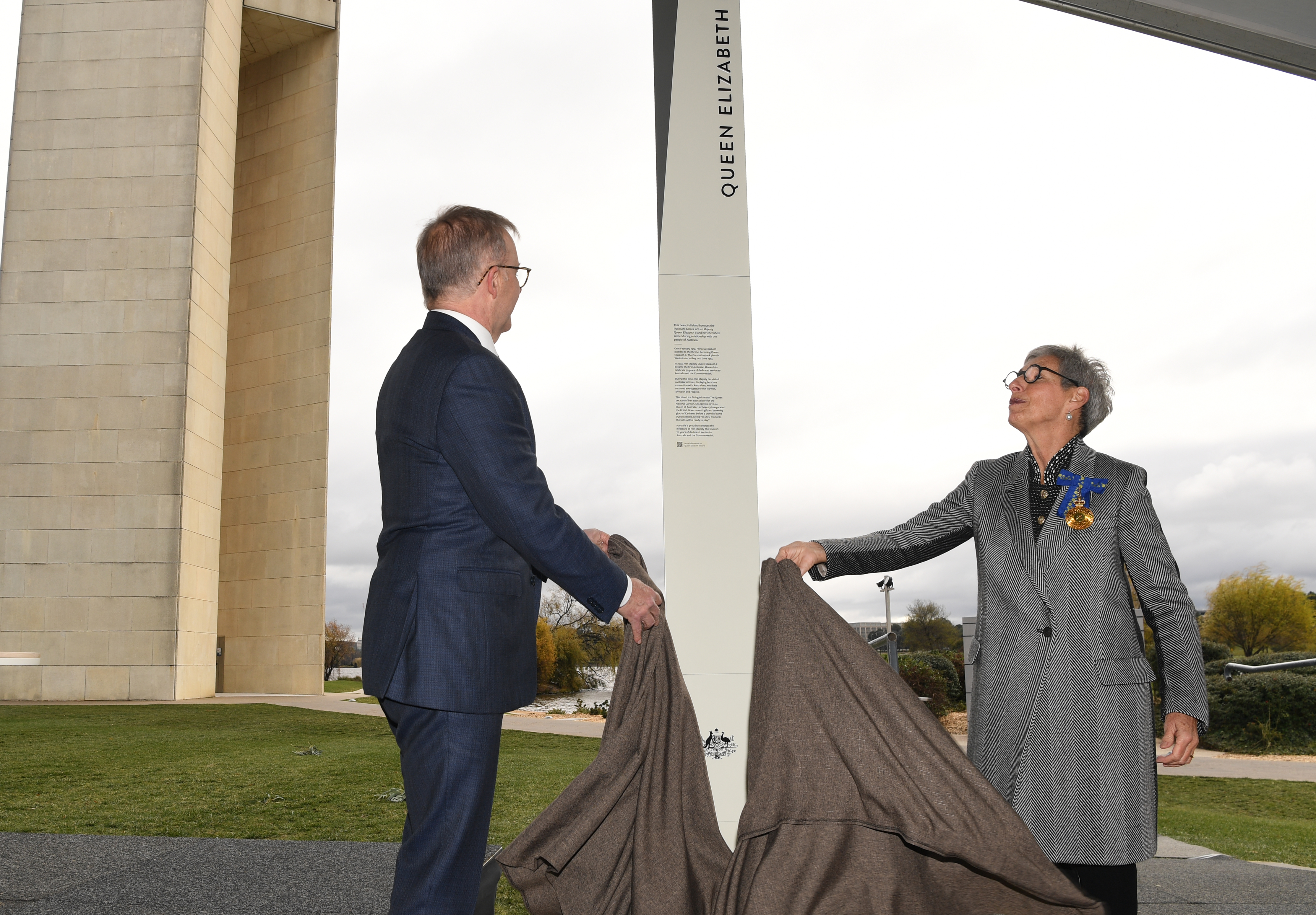 CANBERRA, AUSTRALIA - JUNE 04: Prime Minister Anthony Albanese and Her Excellency the Hon Linda Dessau AC (R) unveil the renaming sign at the renaming of Aspen Island in honour of Queen Elizabeth II as part of the Queen's Platinum Jubilee Celebrations on June 04, 2022 in Canberra, Australia. The Australian Government has renamed Aspen Island on Lake Burley Griffin to Queen Elizabeth II Island, in Her Majesty's honour to as part of The Queen's Platinum Jubilee celebrations marking 70 years of the