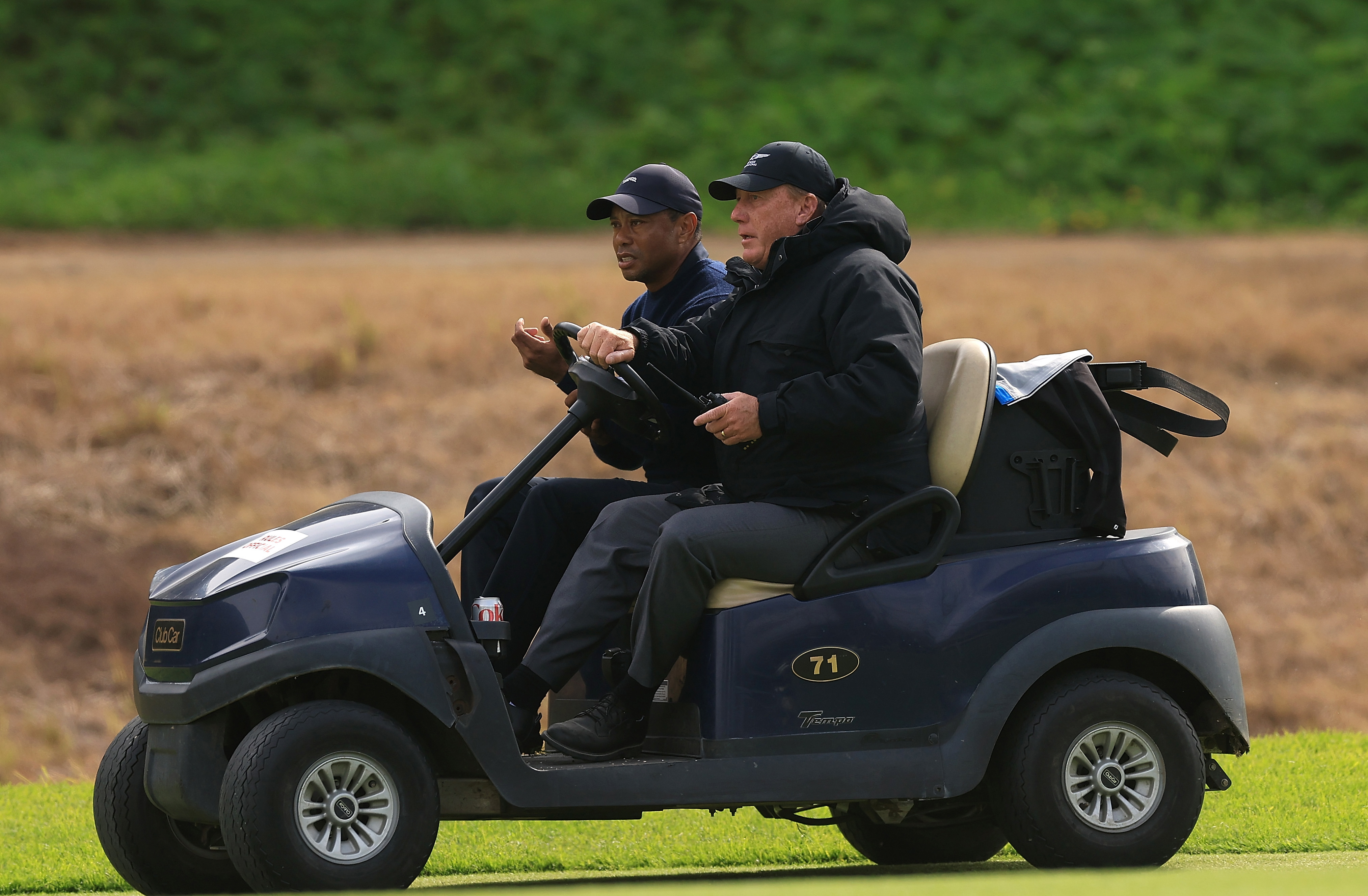 Tiger Woods of the United States is driven from the course by a rules official after withdrawing from the tournament due to illness on the sixth hole during the second round of The Genesis Invitational at Riviera Country Club on February 16, 2024 in Pacific Palisades, California. (Photo by Sean M. Haffey/Getty Images)