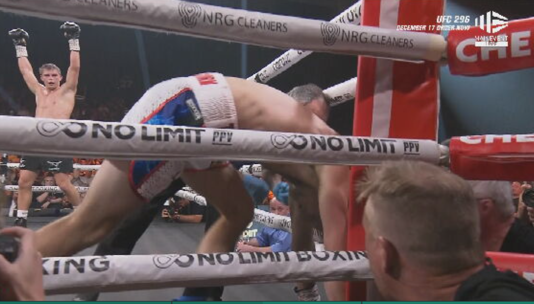 Tszyu celebrates as Biggs struggles to get up.