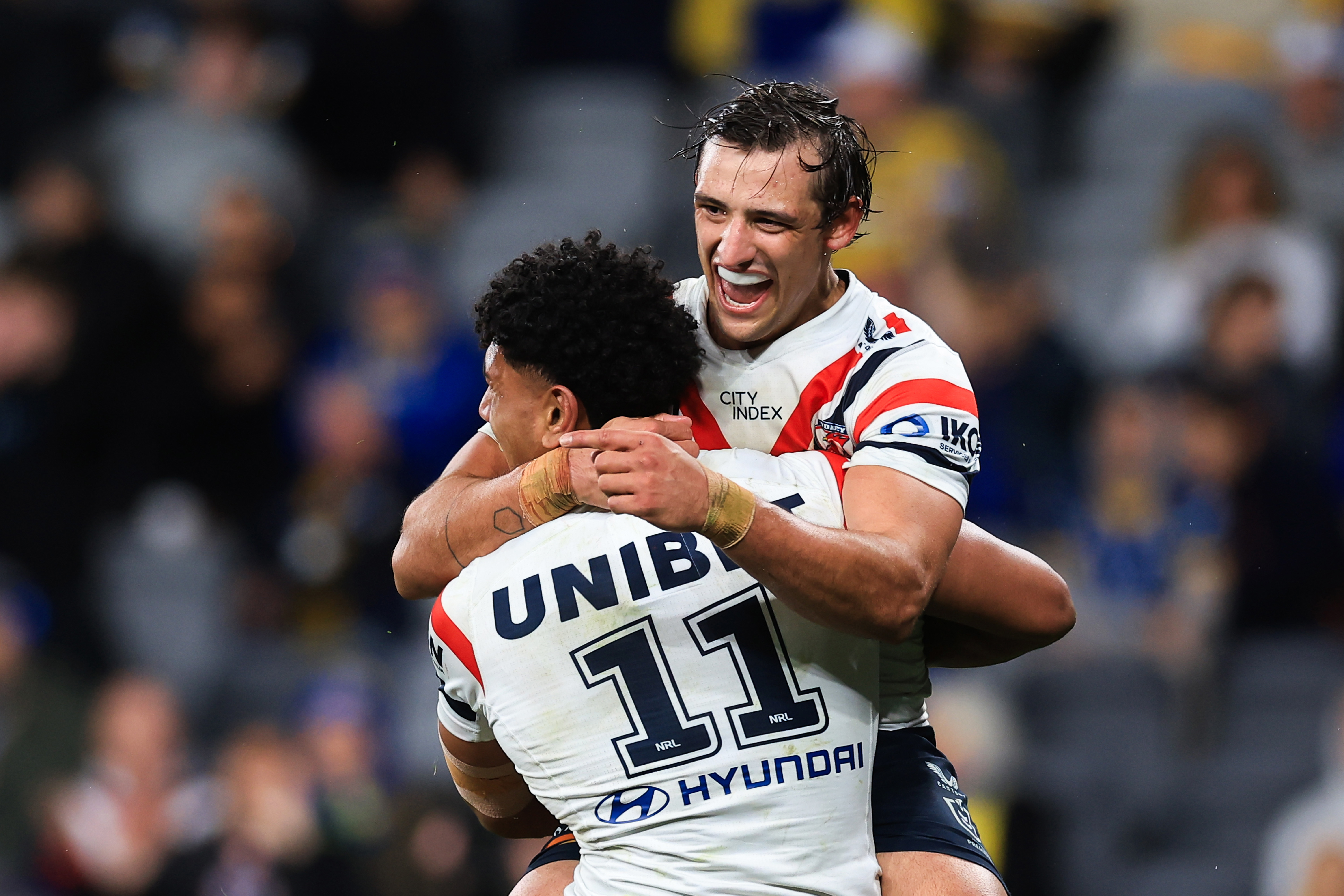 Siua Wong of the Roosters celebrates a try with team mate Billy Smith during the round 25 NRL match between Parramatta Eels and Sydney Roosters at CommBank Stadium on August 18, 2023 in Sydney, Australia. (Photo by Mark Evans/Getty Images)