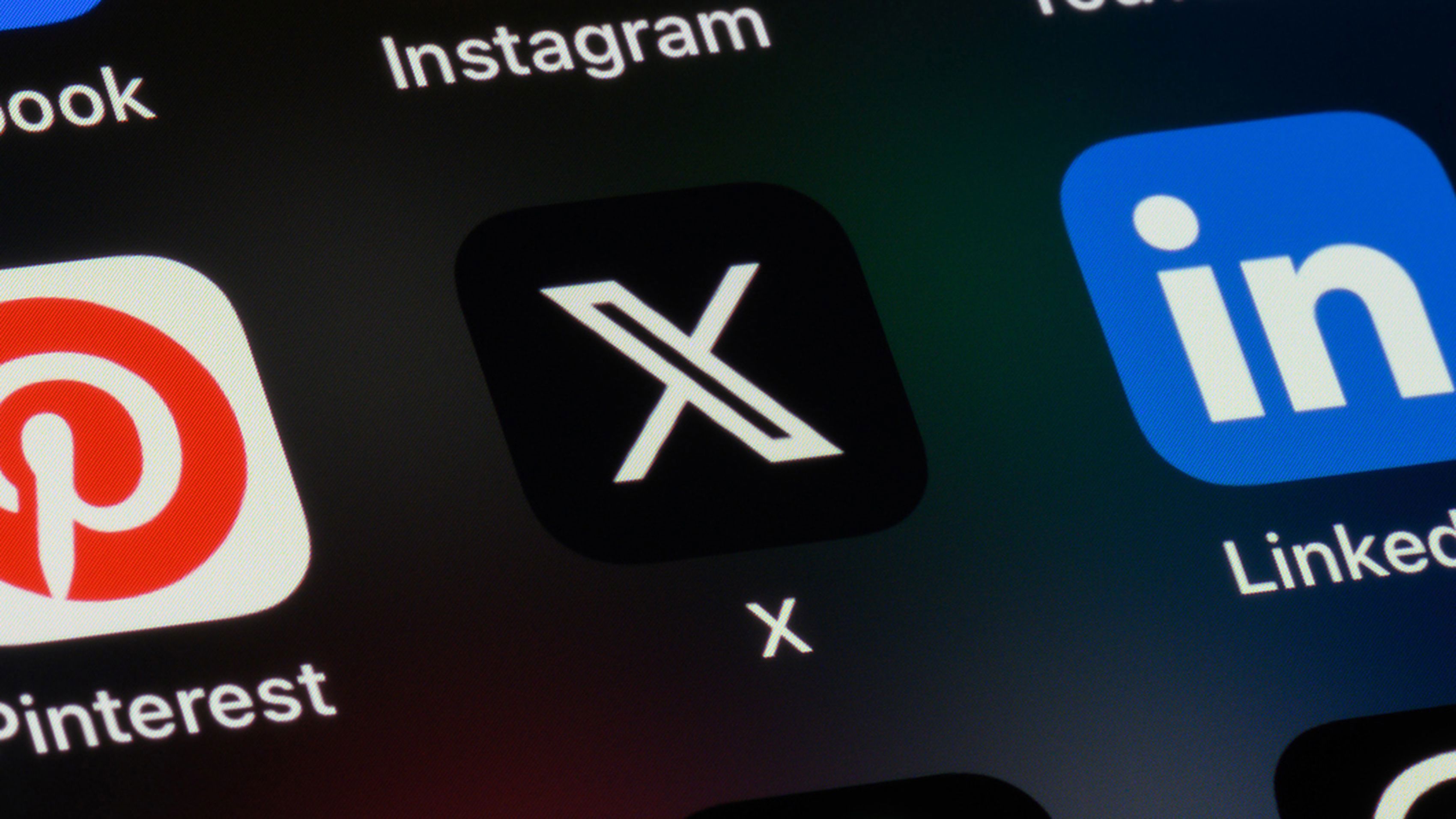 Toronto, Canada - September 24, 2023:  Popular social media apps on an Apple iPhone: Facebook, Instagram, YouTube, Pinterest, X (formerly Twitter), LinkedIn, Reddit, TikTok, and Threads.