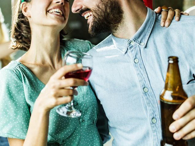 Woman drinking wine with friend