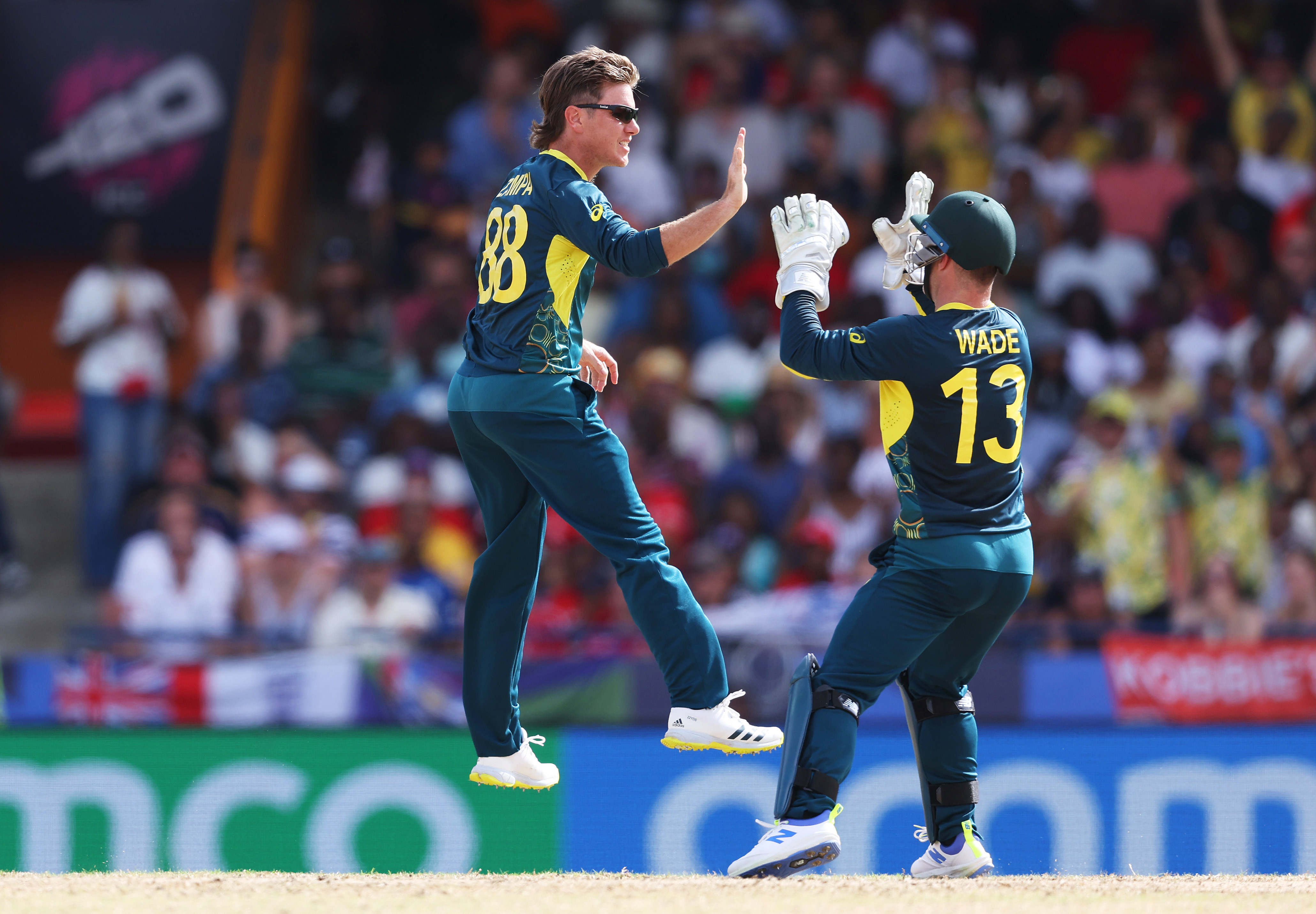 Adam Zampa of Australia celebrates with team mate Matthew Wade of Australia after bowling Phil Salt of England during the ICC Men's T20 Cricket World Cup West Indies & USA 2024 match between Australia  and England at  Kensington Oval on June 08, 2024 in Bridgetown, Barbados. (Photo by Matthew Lewis-ICC/ICC via Getty Images)