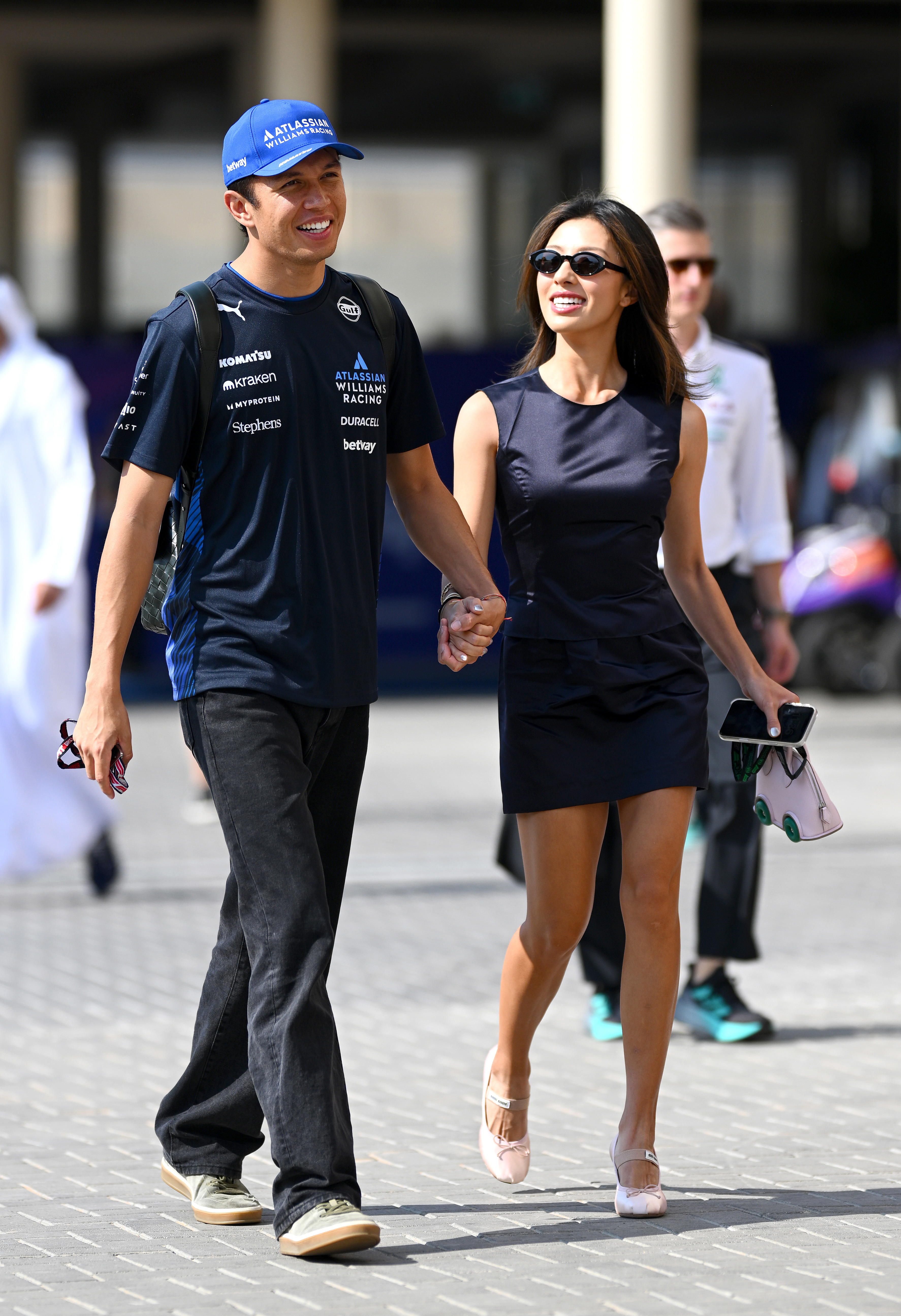 ABU DHABI, UNITED ARAB EMIRATES - DECEMBER 07: Alexander Albon of Thailand and Williams in the Paddock with Lily Muni He prior to the F1 Grand Prix of Abu Dhabi at Yas Marina Circuit on December 07, 2025 in Abu Dhabi, United Arab Emirates. (Photo by Clive Mason/Getty Images)