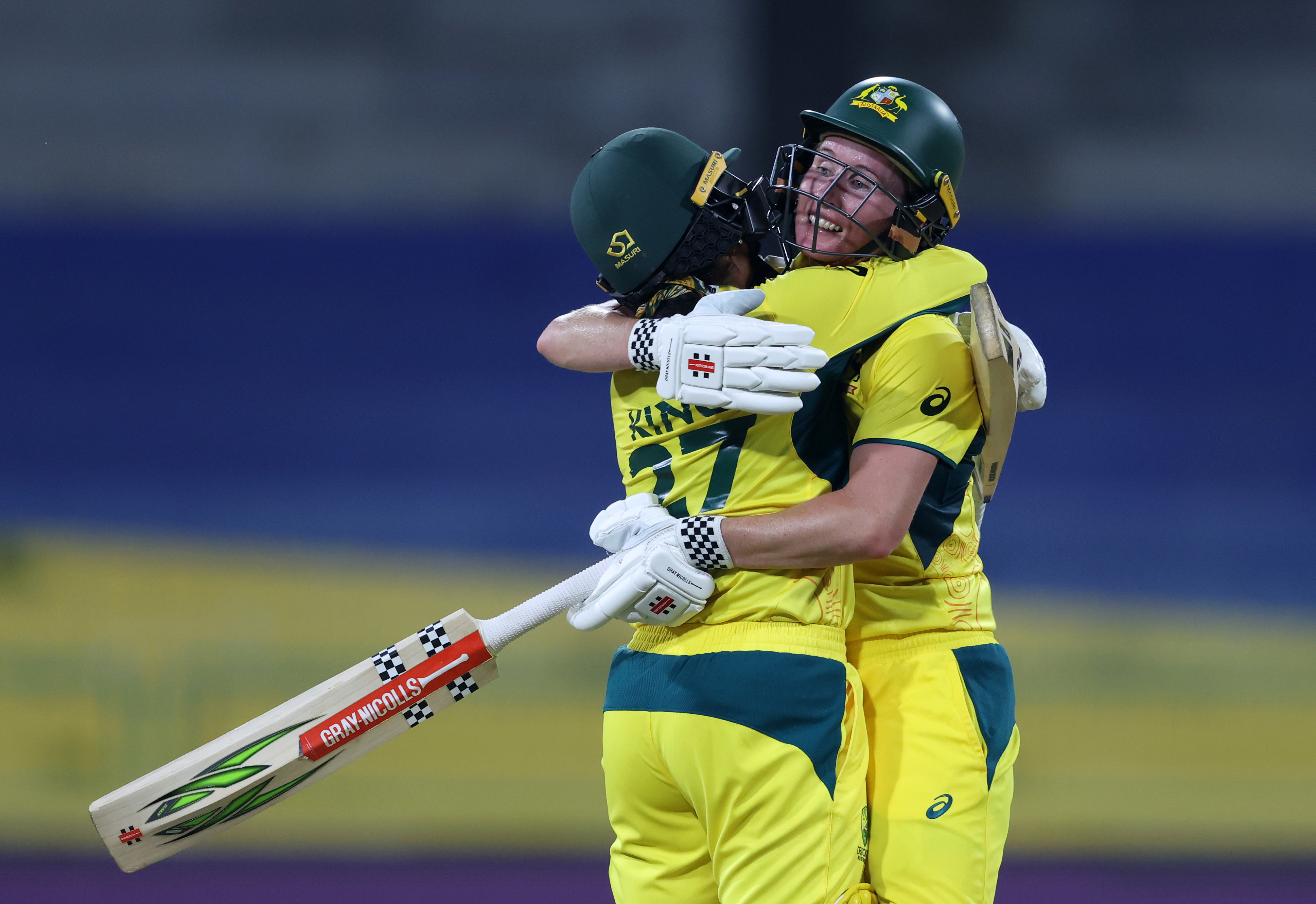 Beth Mooney is congratulated by Alana King after bringing up her century during Australia's ICC Women's Cricket World Cup clash with Pakistan.

