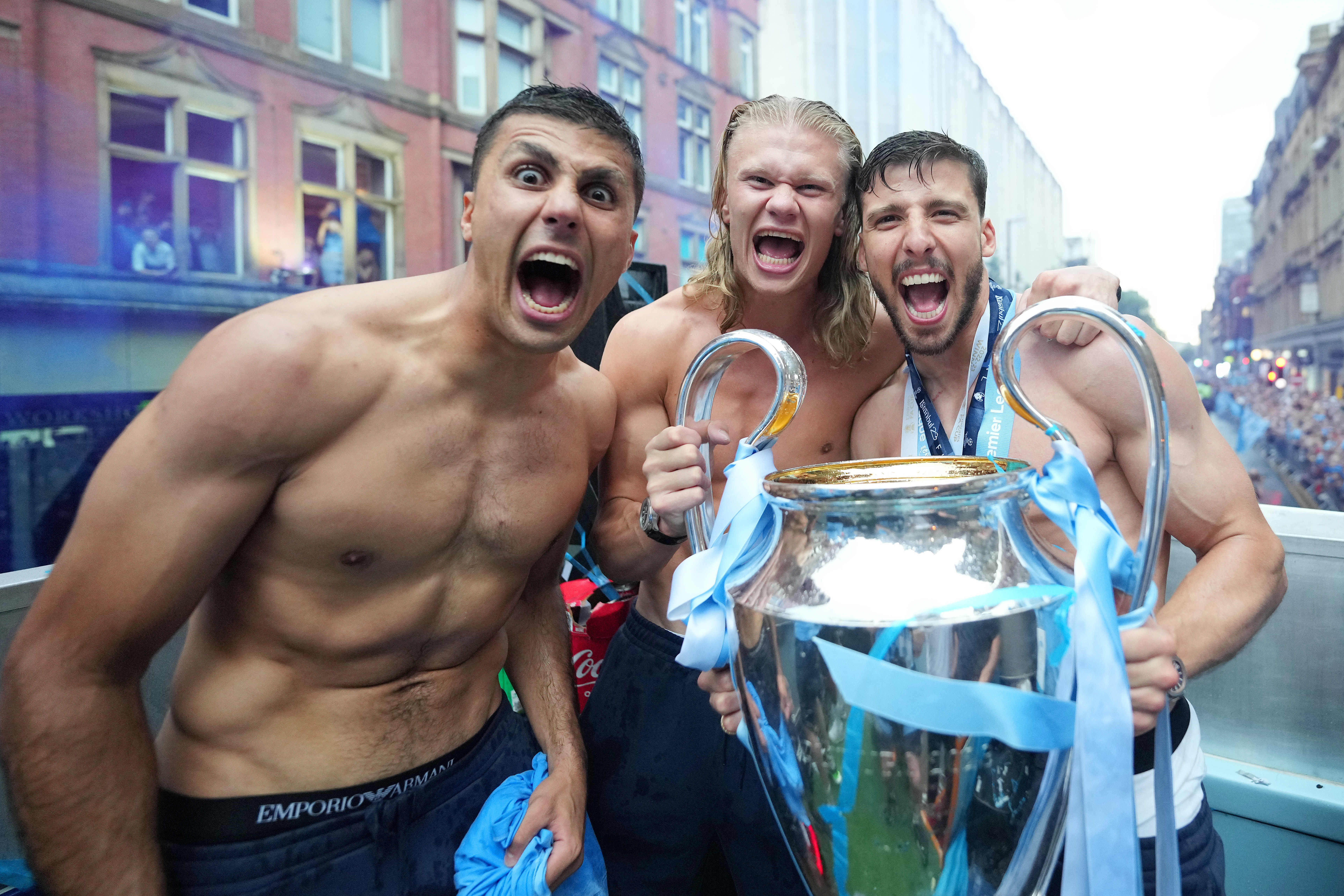 Rodri celebrates with Erling Haaland and Ruben Dias of Manchester City.