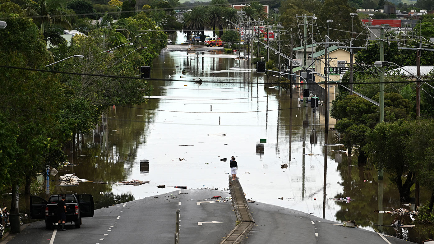 A main street is under floodwater in Lismore.