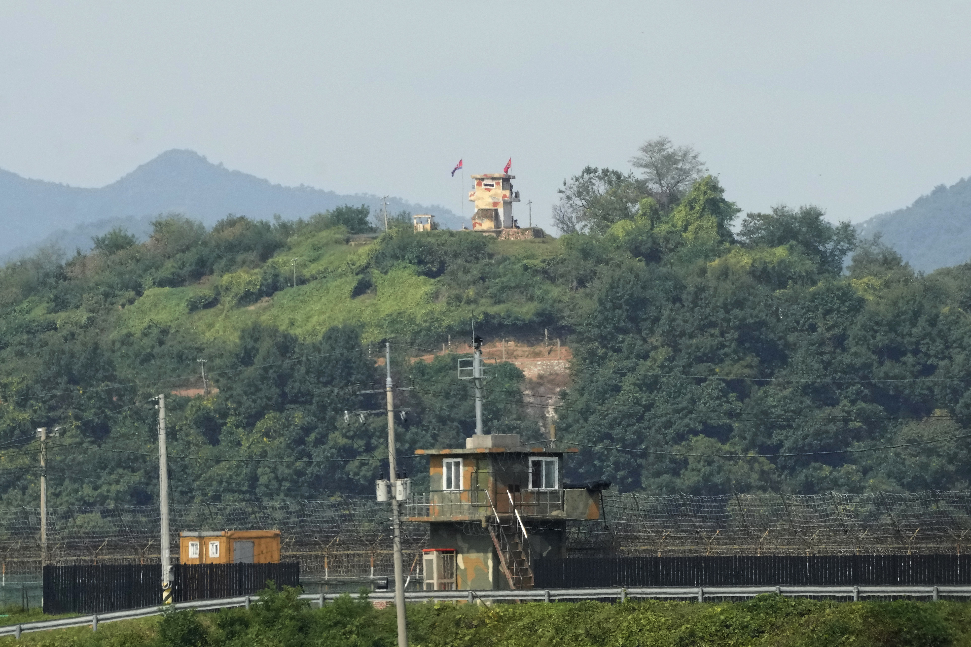 Military guard posts of North Korea, rear, and South Korea, bottom, are seen in Paju, near the border. 