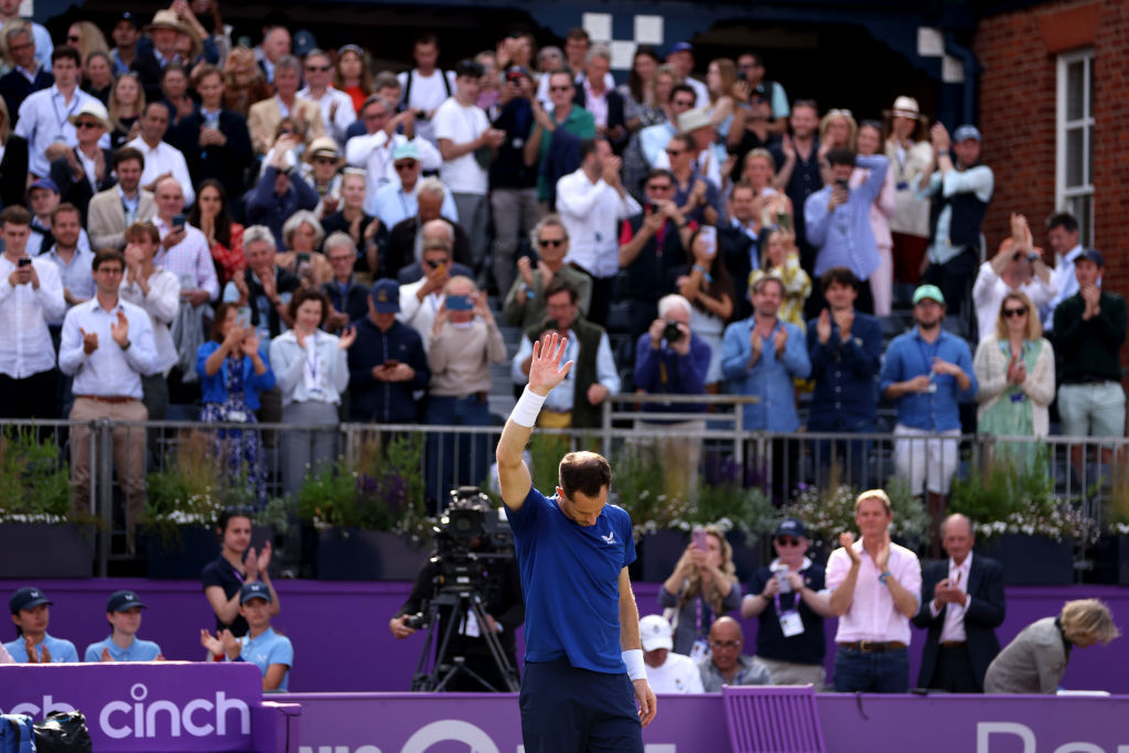 Andy Murray acknowledges the fans as he is forced to pull out of the match due to injury against Jordan Thompson.