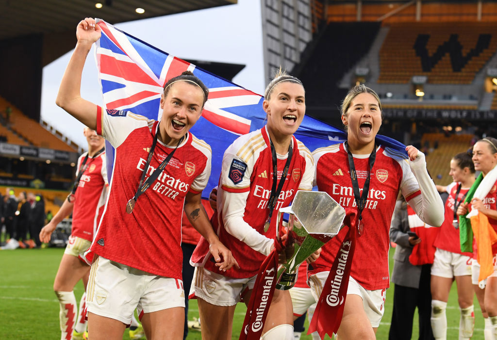 Caitlin Foord, Steph Catley and Kyra Cooney-Cross of Arsenal celebrate with the trophy after winning the FA Women's Continental Tyres League Cup Final.