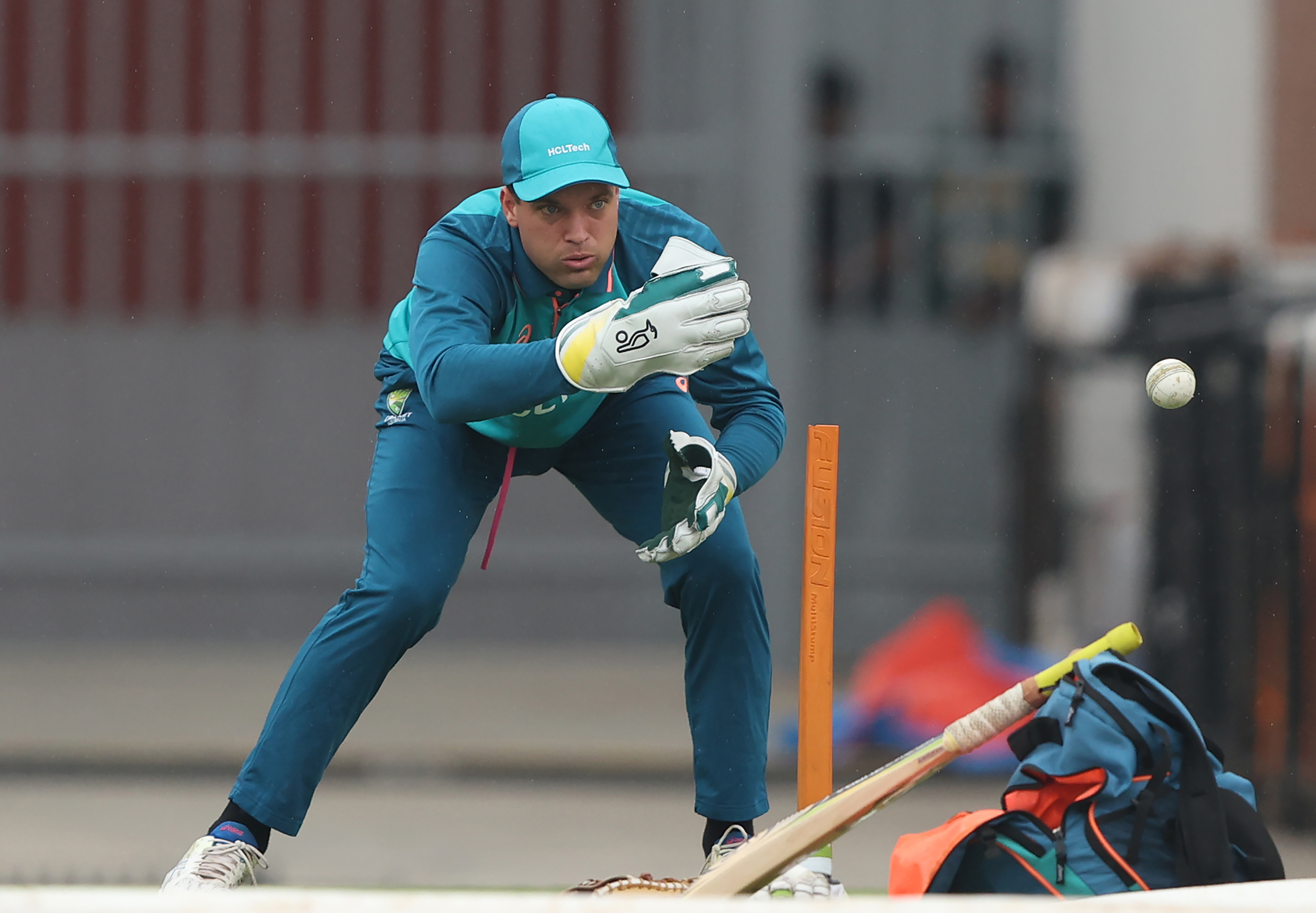 Alex Carey fields during an Australian training session.