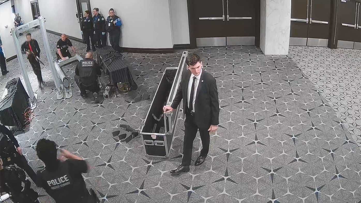 Surveillance footage shows gunman charging through officers