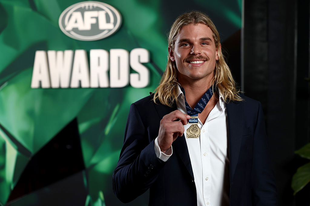 Bailey Smith of the Cats poses after being awarded the AFL Coaches Association Champion Player of the Year.