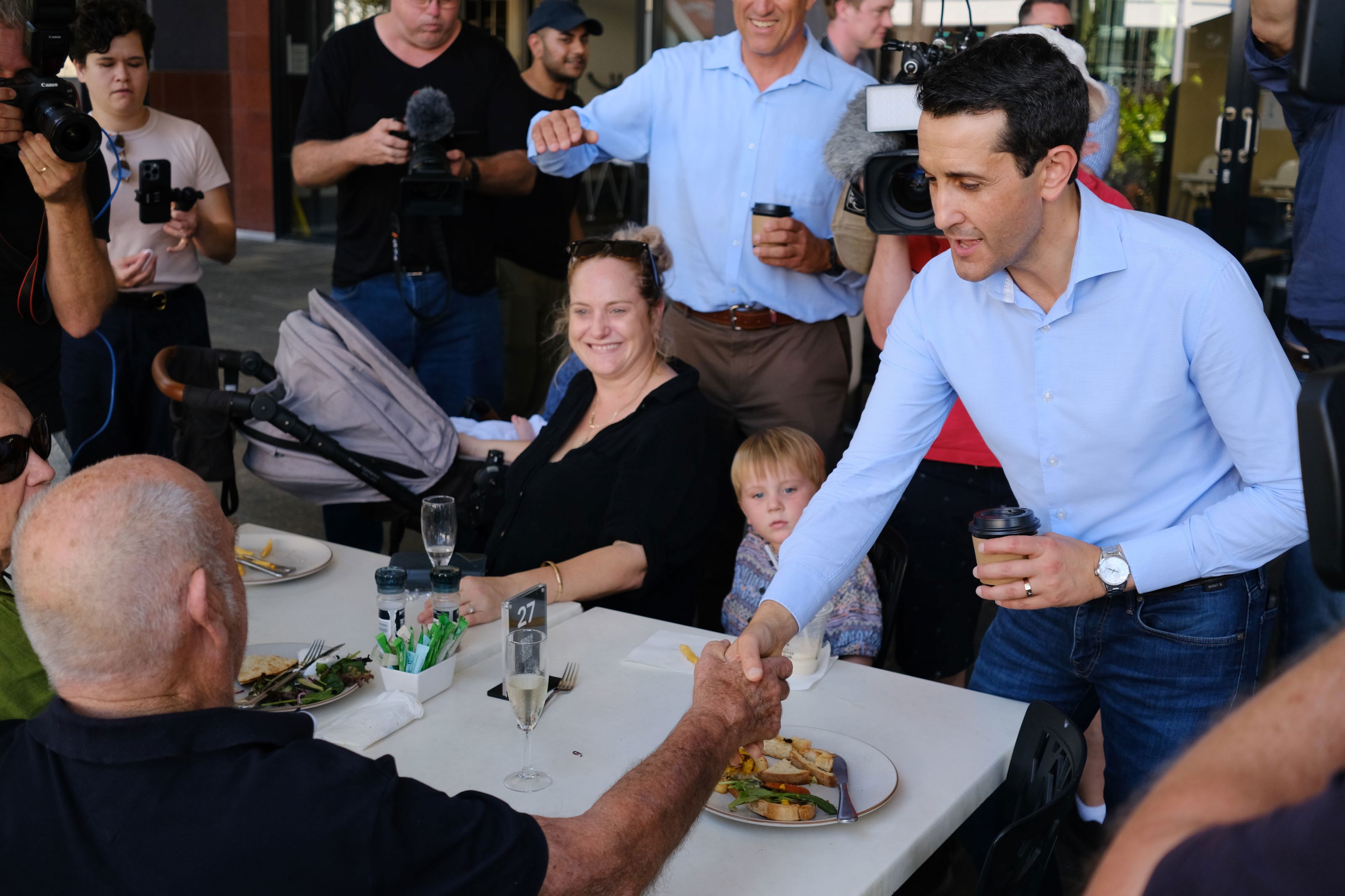 Queensland state LNP leader David Crisafulli speaks to locals on a walk through Mackay – held by Labor since 1915 – during the state election campaign on Wednesday October 9.