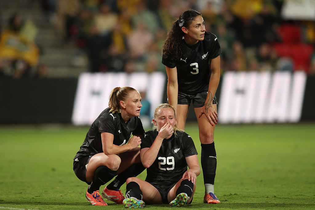 Katie Kitching is consoled by teammates after copping a falcon.