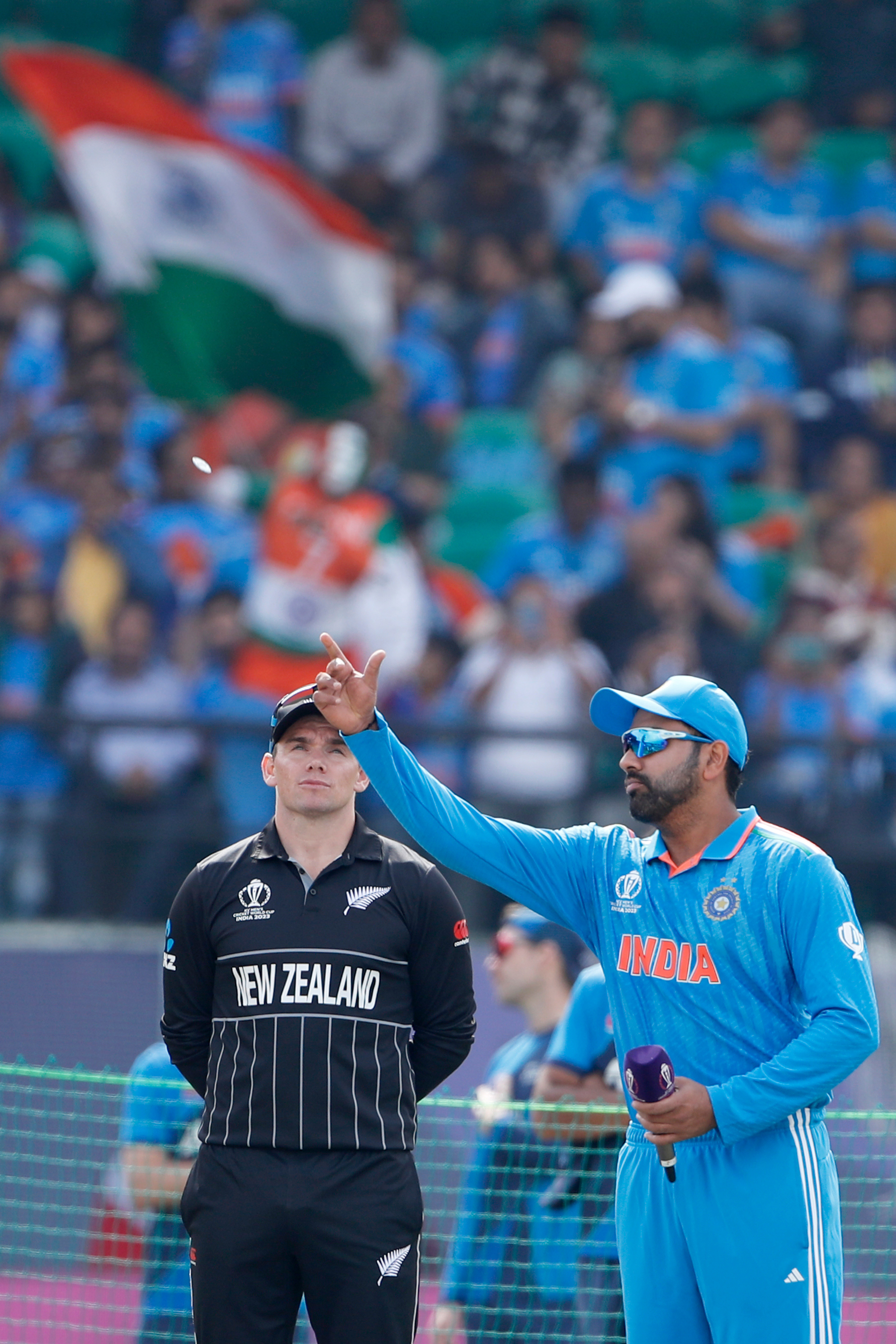 DHARAMSALA, INDIA - OCTOBER 22:  Tom Latham of the New Zealand  L) and Rohit Sharma of the India at toss during the ICC Men's Cricket World Cup India 2023 between India and New Zealand at HPCA Stadium on October 22, 2023 in Dharamsala, India. (Photo by Surjeet Yadav/Getty Images)
