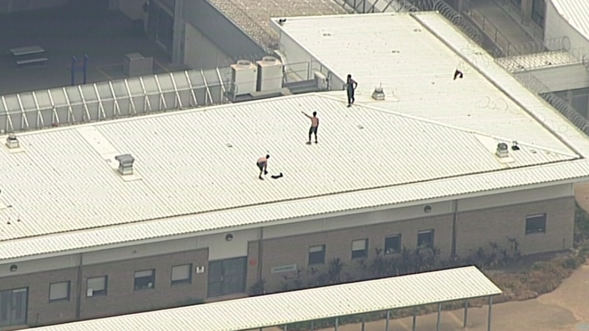 Youths on the roof of the Cobham Youth Justice Centre.
