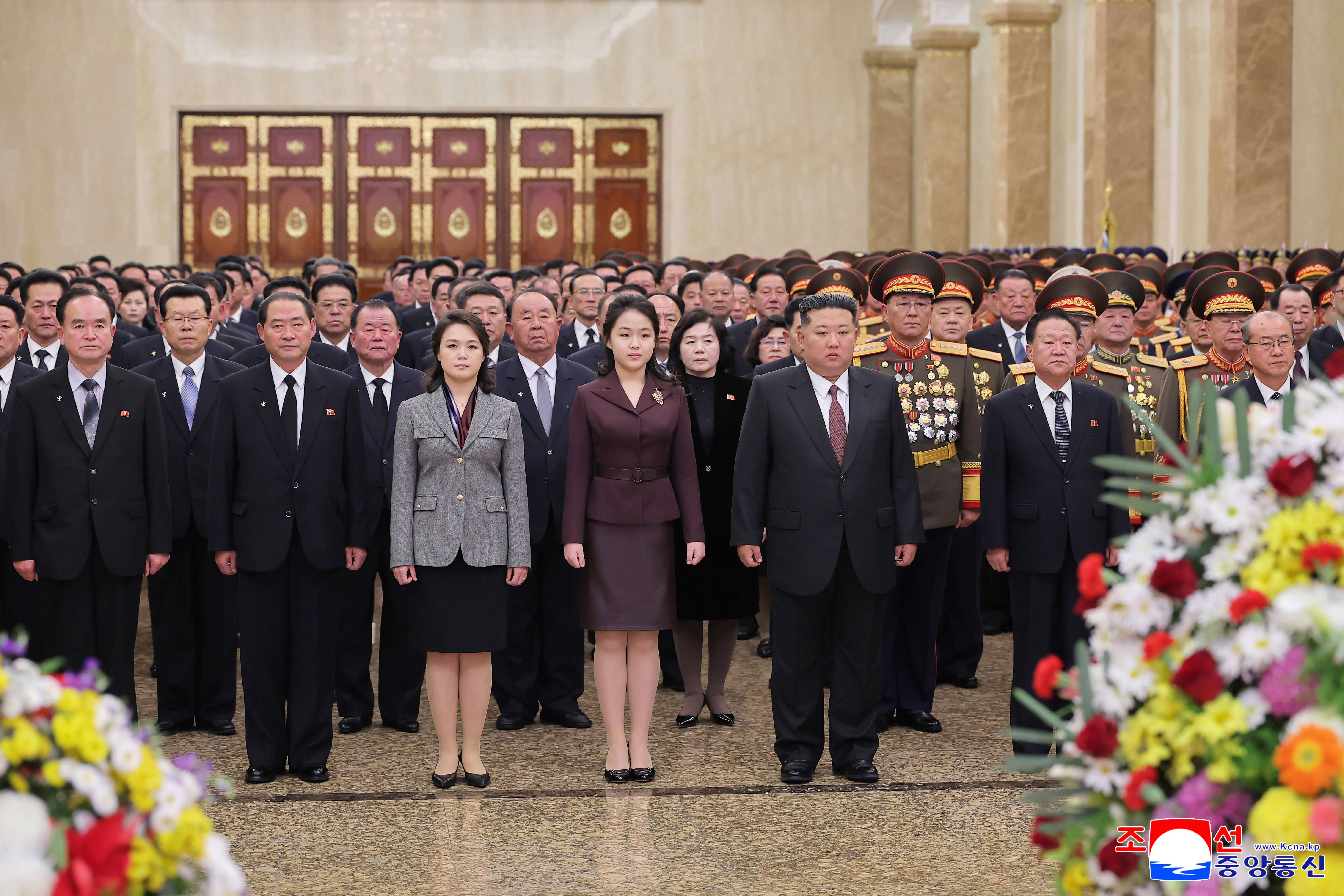 In this photo provided by the North Korean government, leader Kim Jong Un, center right, his wife Ri Sol Ju, third left, and their daughter, center, believed to be named Kim Ju Ae, visit Kumsusan Palace of the Sun in Pyongyang, North Korea, Thursday, Jan. 1, 2026.