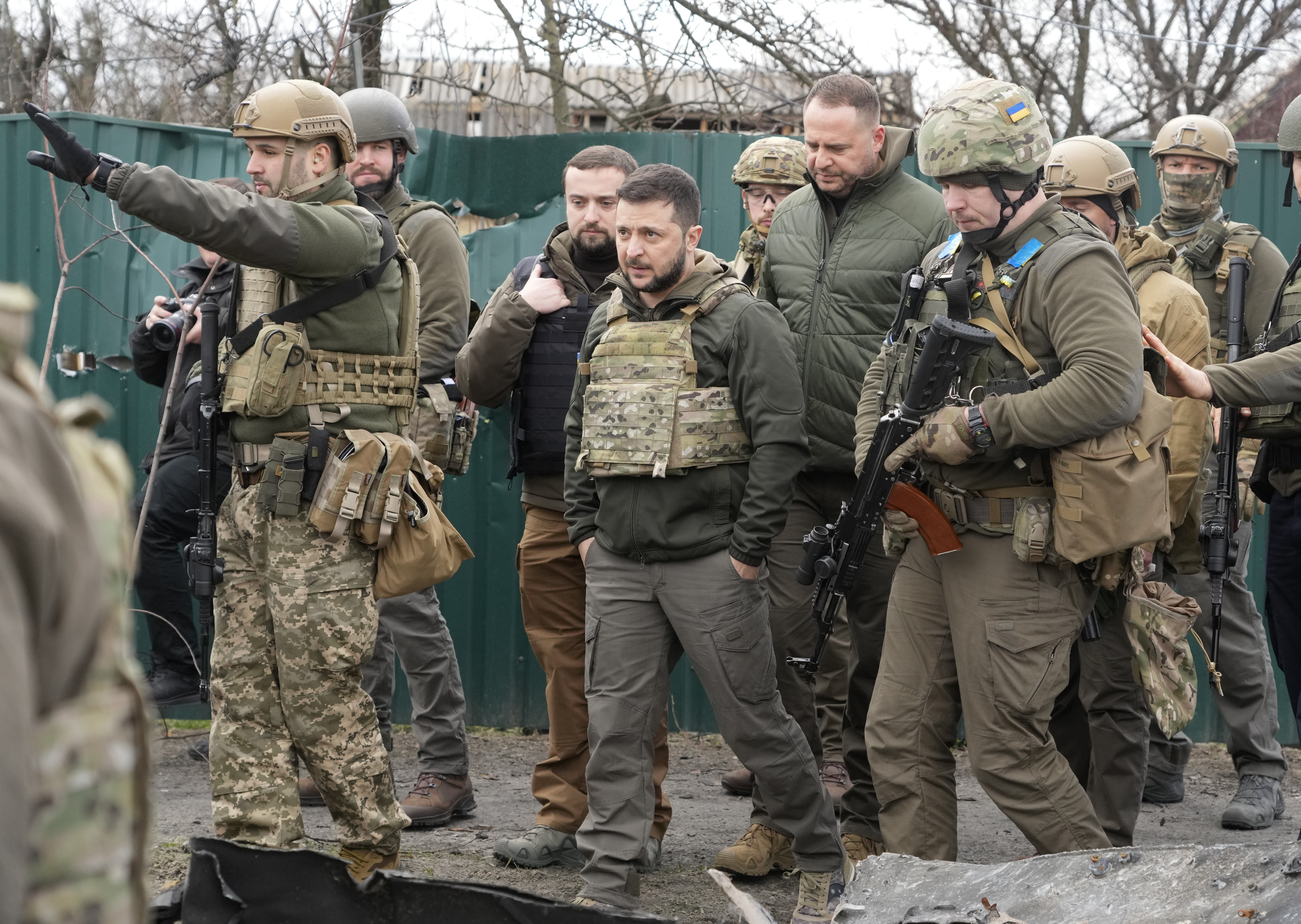 Ukrainian President Volodymyr Zelenskyy examines the site of a recent battle in Bucha close to Kyiv, Ukraine on April 4, 2022