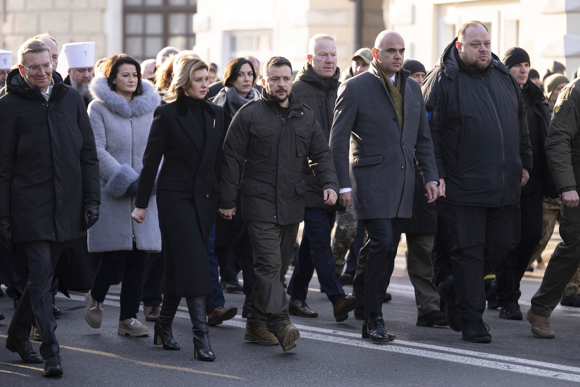 Ukrainian President Volodymyr Zelenskyy and his wife Olena Zelenska, walk next to Alain Berset, President of the Swiss Confederation, second-right, Ruslan Stefanchuk, Speaker of Ukrainian parliament, right, and Edgars Rinkevics, President of Latvia, left, during the commemoration ceremony of the Holodomor's victims (1932-1933) in Ukraine, in Kyiv, Ukraine, Saturday, Nov. 25, 2023.