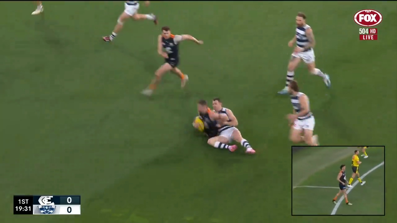 Patrick Dangerfield tackles Sam Walsh.