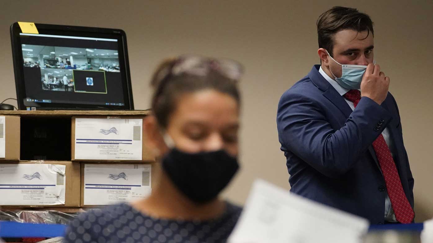 A Republican observer watches ballots being counted in Allentown, Pennsylvania.