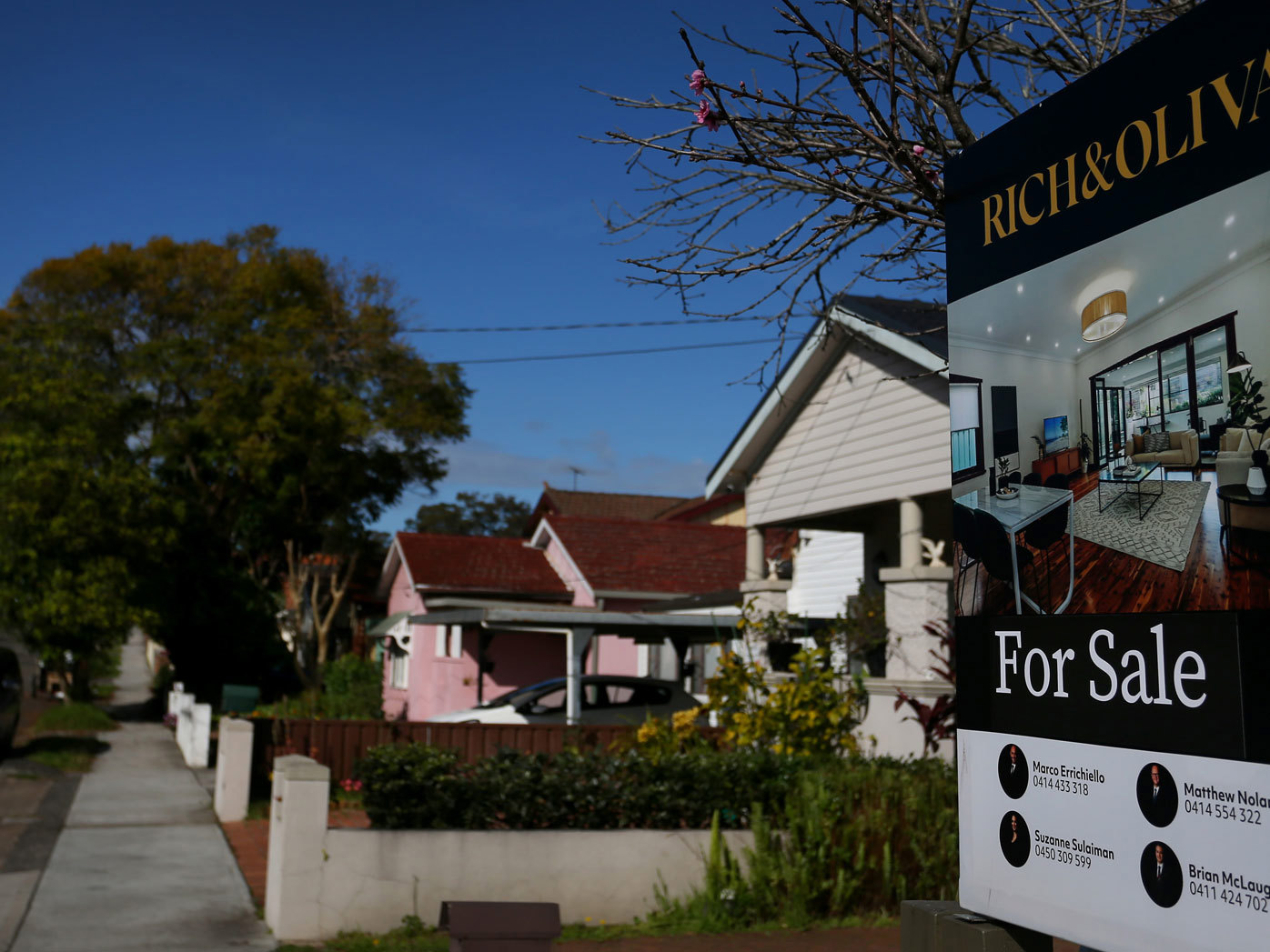 A real estate sign is seen at a property in Croydon Park in Sydney, Australia