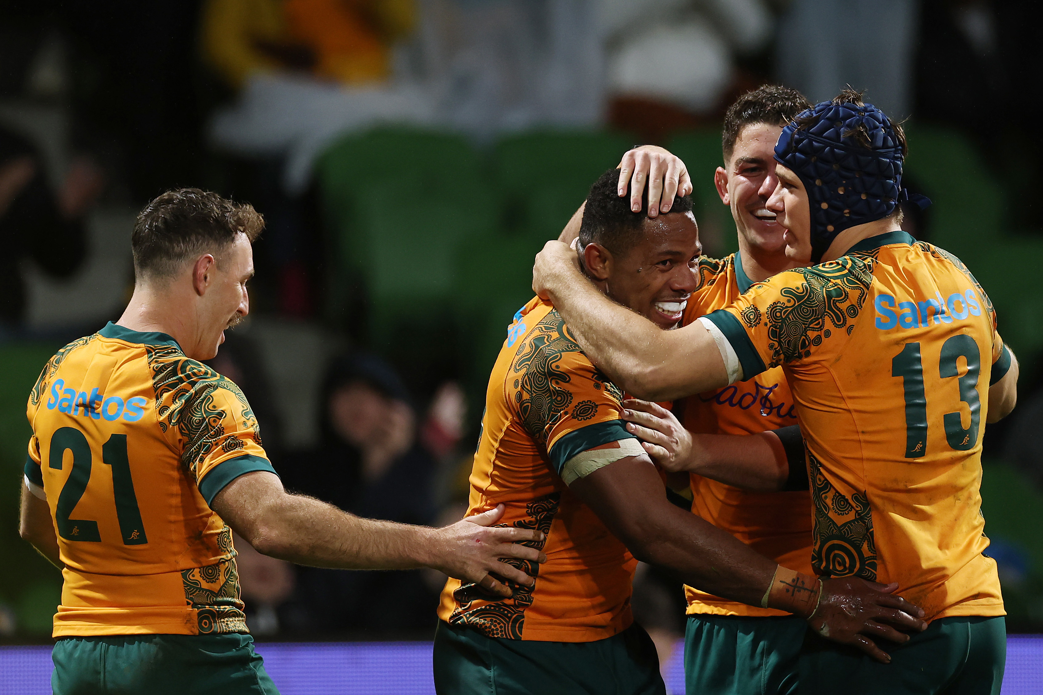 Filipo Daugunu of the Wallabies celebrates with after scoring a try.