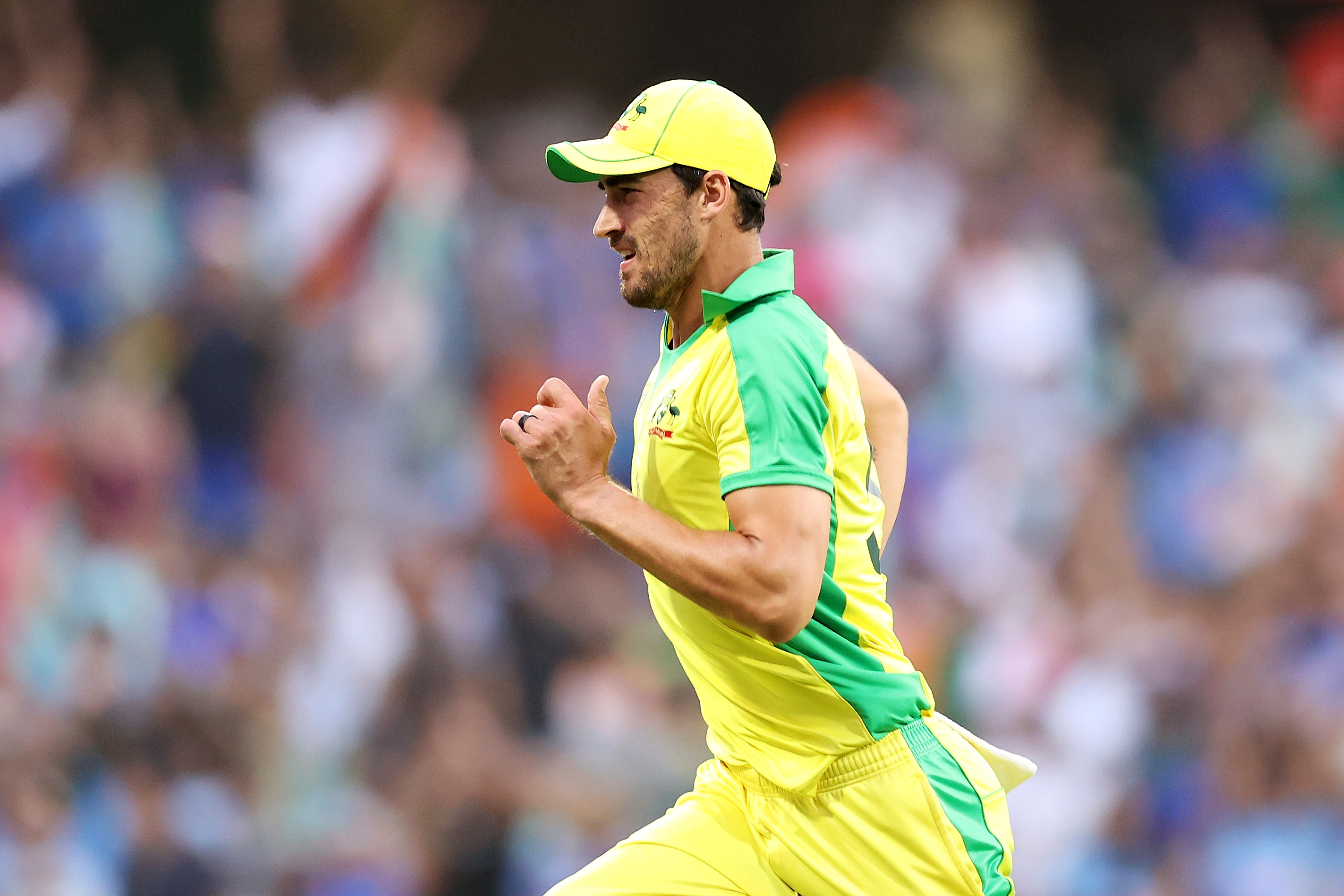 Mitchell Starc of Australia chases the ball.