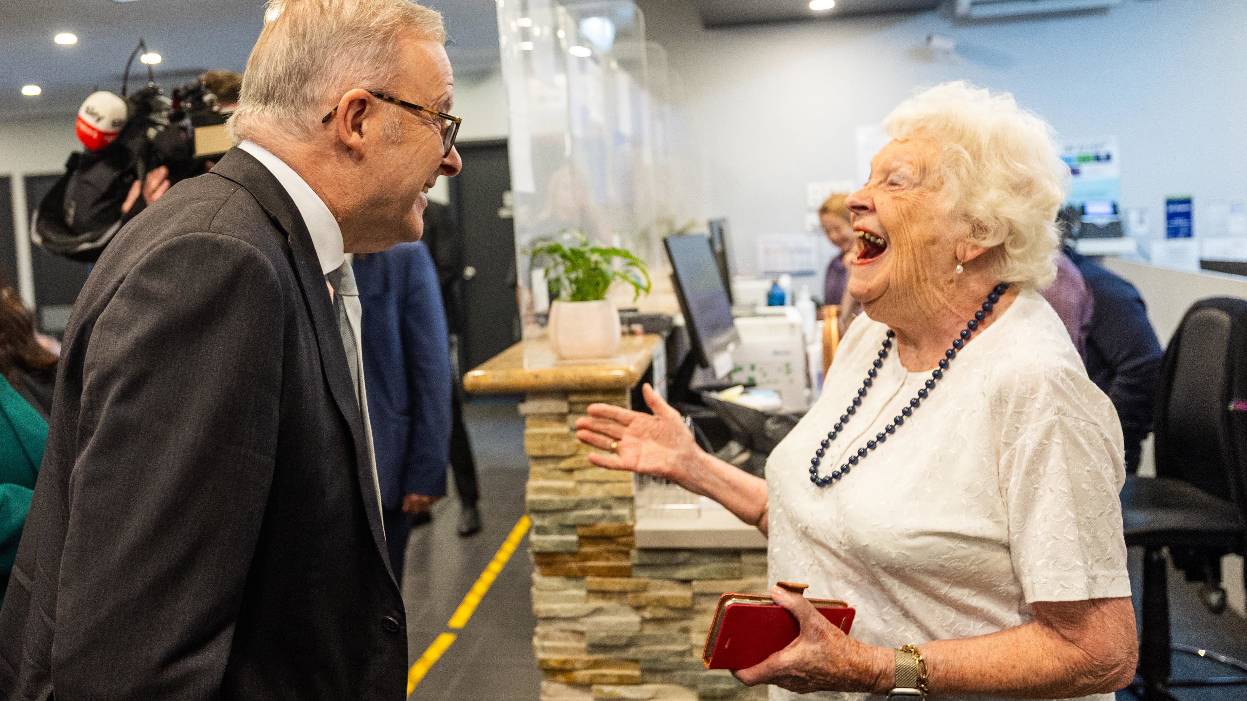 Prime Minister Anthony Albanese shares a joke with 96-year-old Eve Cazalet at Burwood Healthcare. 