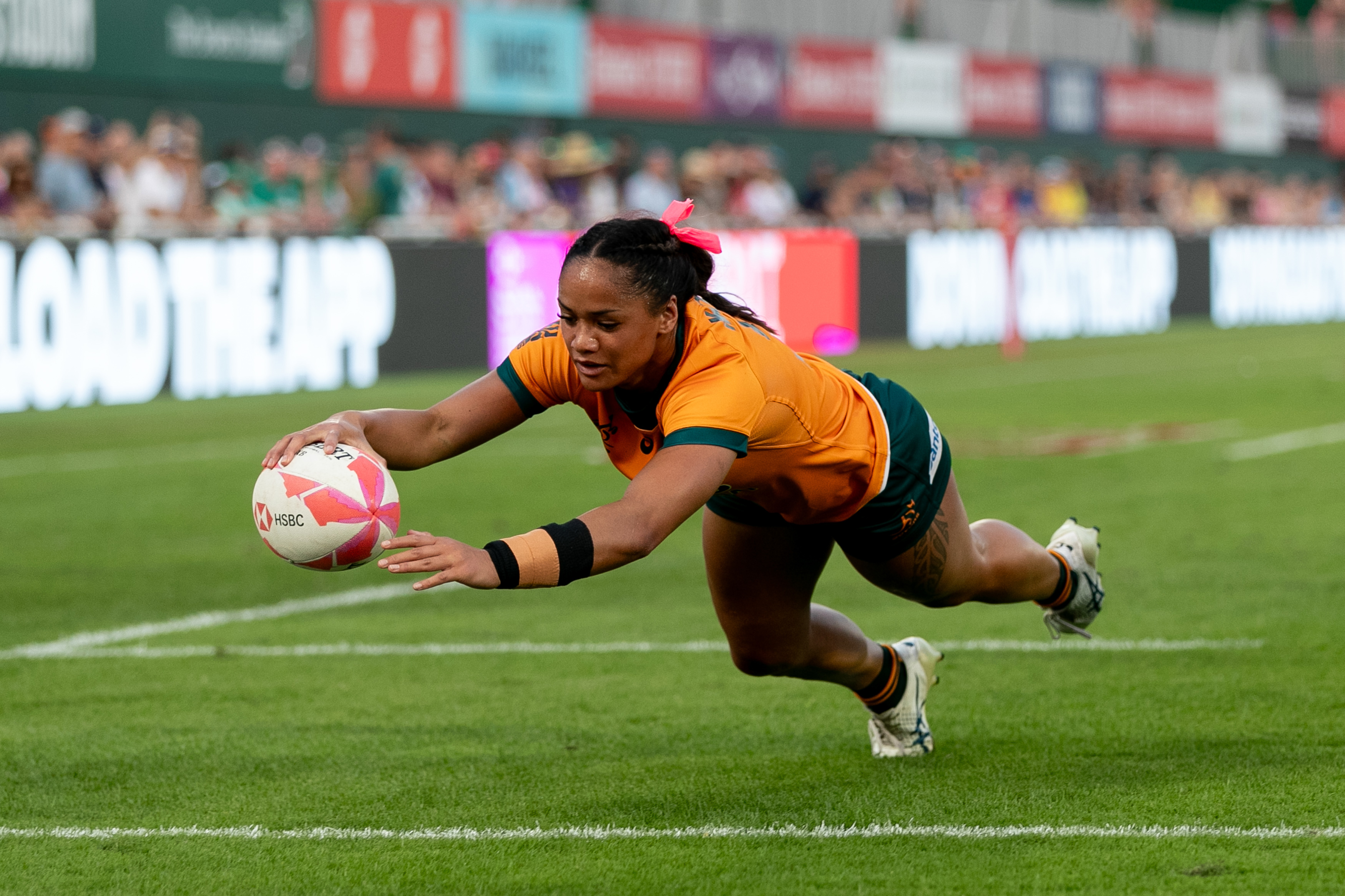 Faith Nathan of Australia dives over the line to score a try.