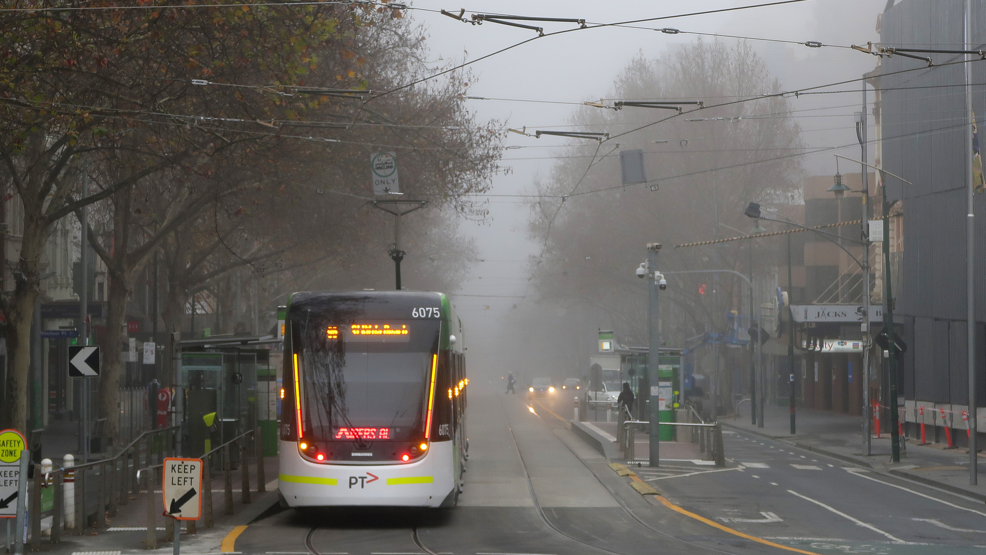 Fog is seen over the the top end of an almost empty Bourke St on July 17, 2020 in Melbourne, Australia.
