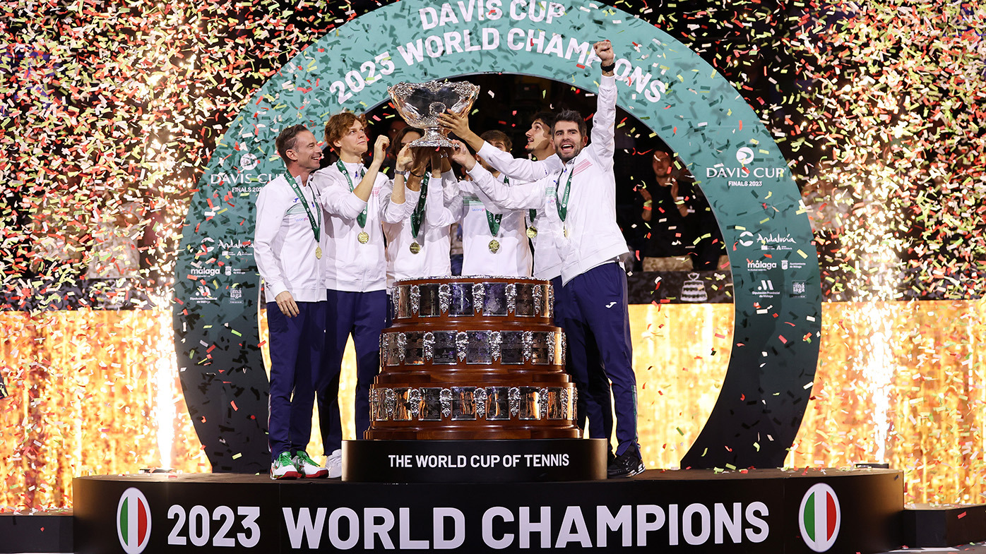 The Italy Davis Cup team lift the trophy after defeating Australia in the final.