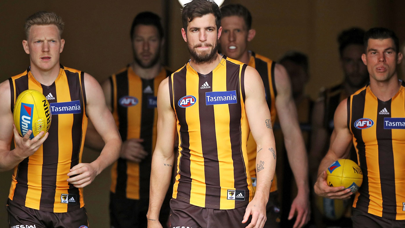 James Sicily, Ben Stratton and Jaeger O'Meara of the Hawks