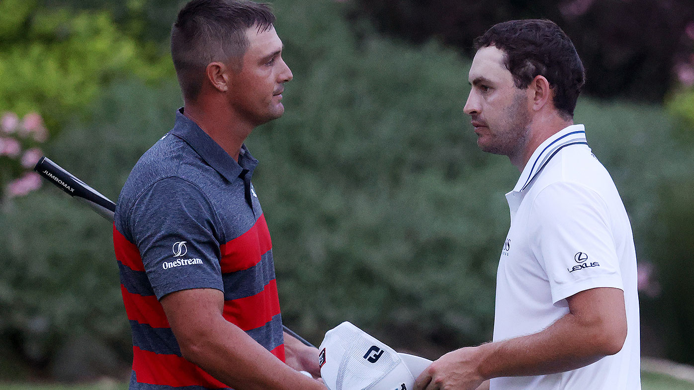 Bryson DeChambeau (L) of the United States congratulates Patrick Cantlay of the United States after Cantlay defeated DeChambeau on the sixth playoff hole during the final round of the BMW Championship at Caves Valley Golf Club on August 29, 2021 in Owings Mills, Maryland. (Photo by Rob Carr/Getty Images)