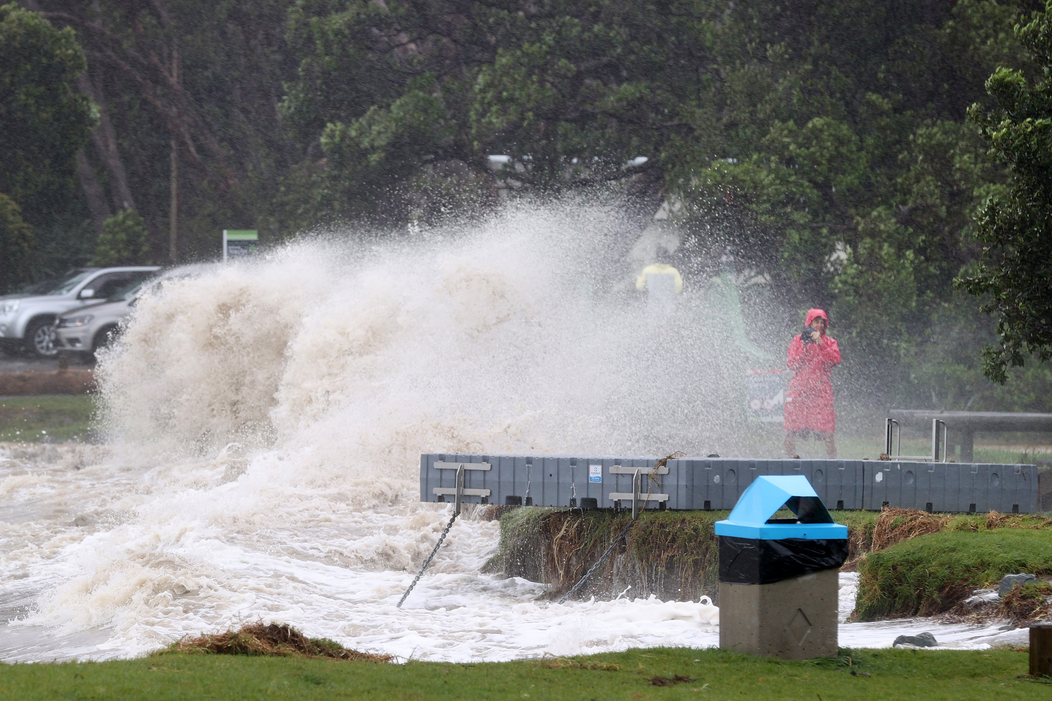 People out looking at the effects of Cyclone Gabrielle at Mathesons Bay Beach on the Matakana Coast on February 13 in Auckland, New Zealand. 