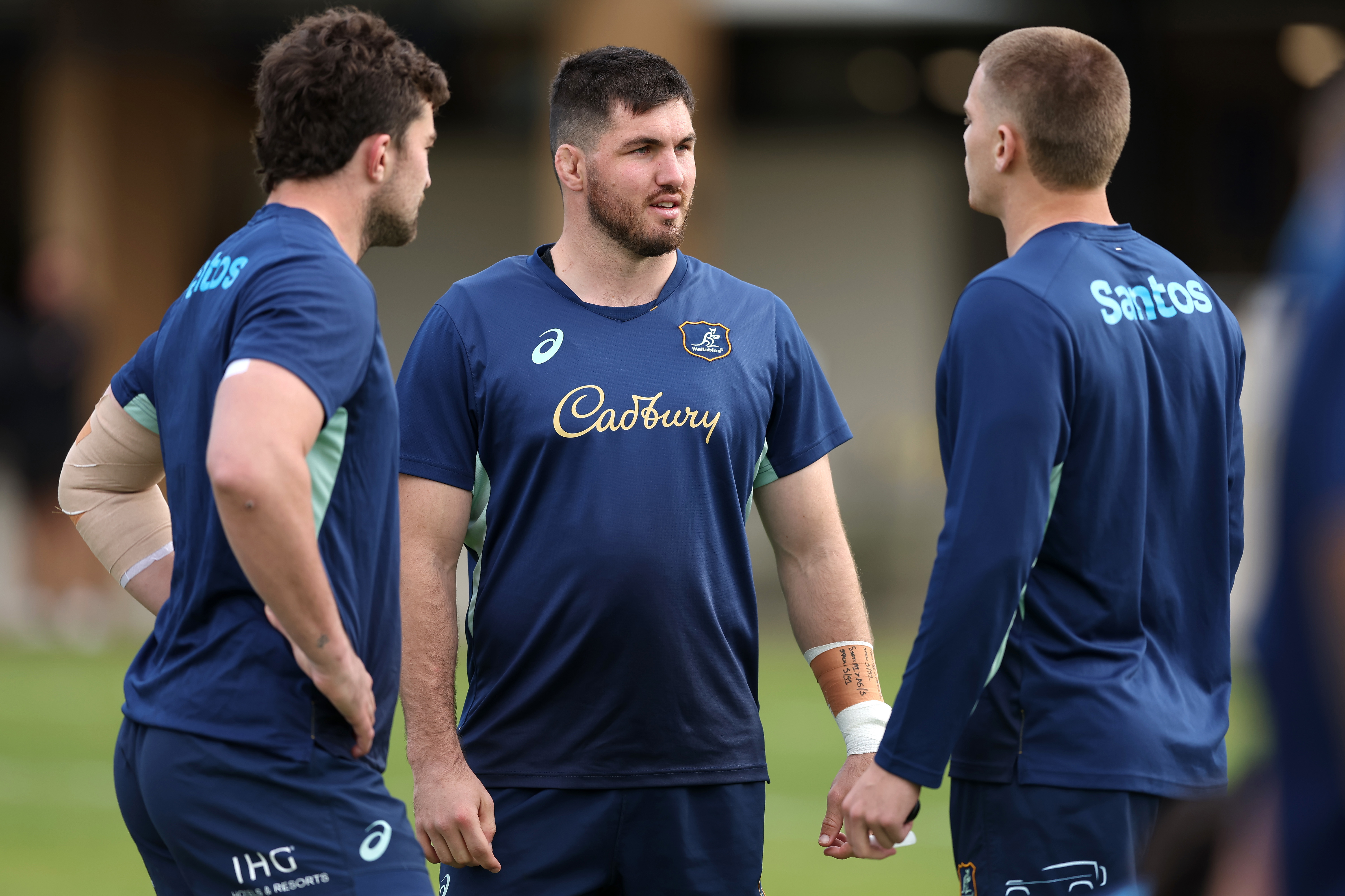 Liam Wright talks to teammates during a Wallabies training session at David Phillips Sports Complex.