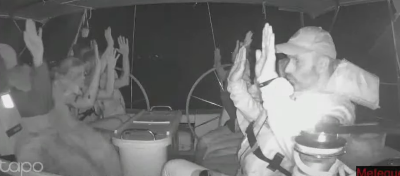 A screenshot of the footage from the livestream of the Gaza flotilla shows passengers on one boat appearing to be detained by military forces.