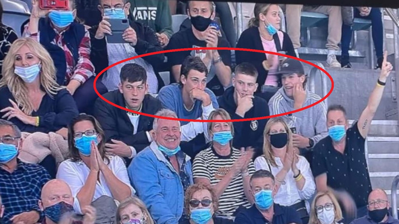 Four Port Adelaide players are in hot water after being seen without masks at the Olympic swimming trials.