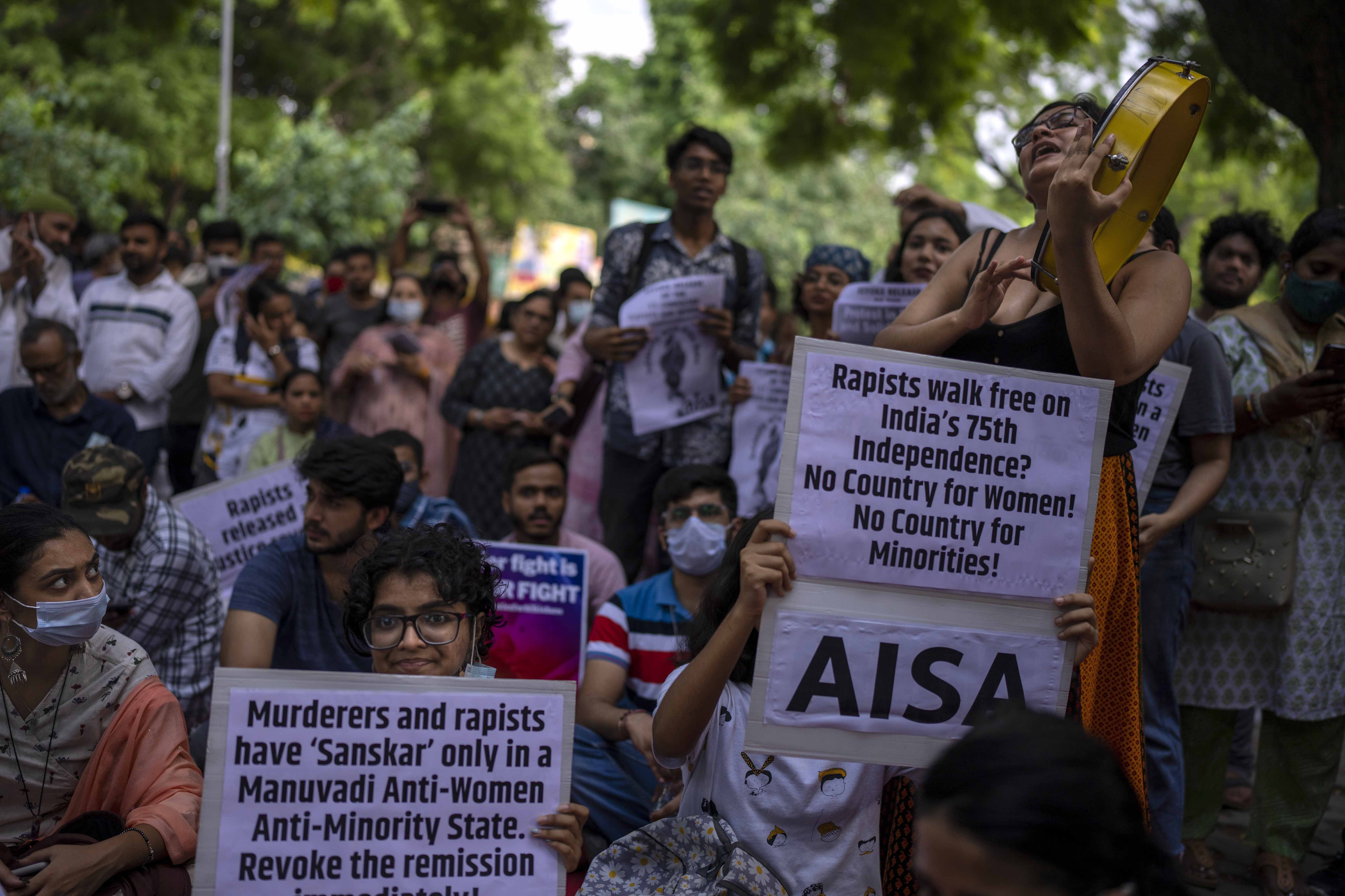 Activists hold placards as they participate in a protest demonstration against remission of sentence by the government to convicts of a gang rape of a Muslim woman, in New Delhi, India, Saturday, August 27, 2022.  