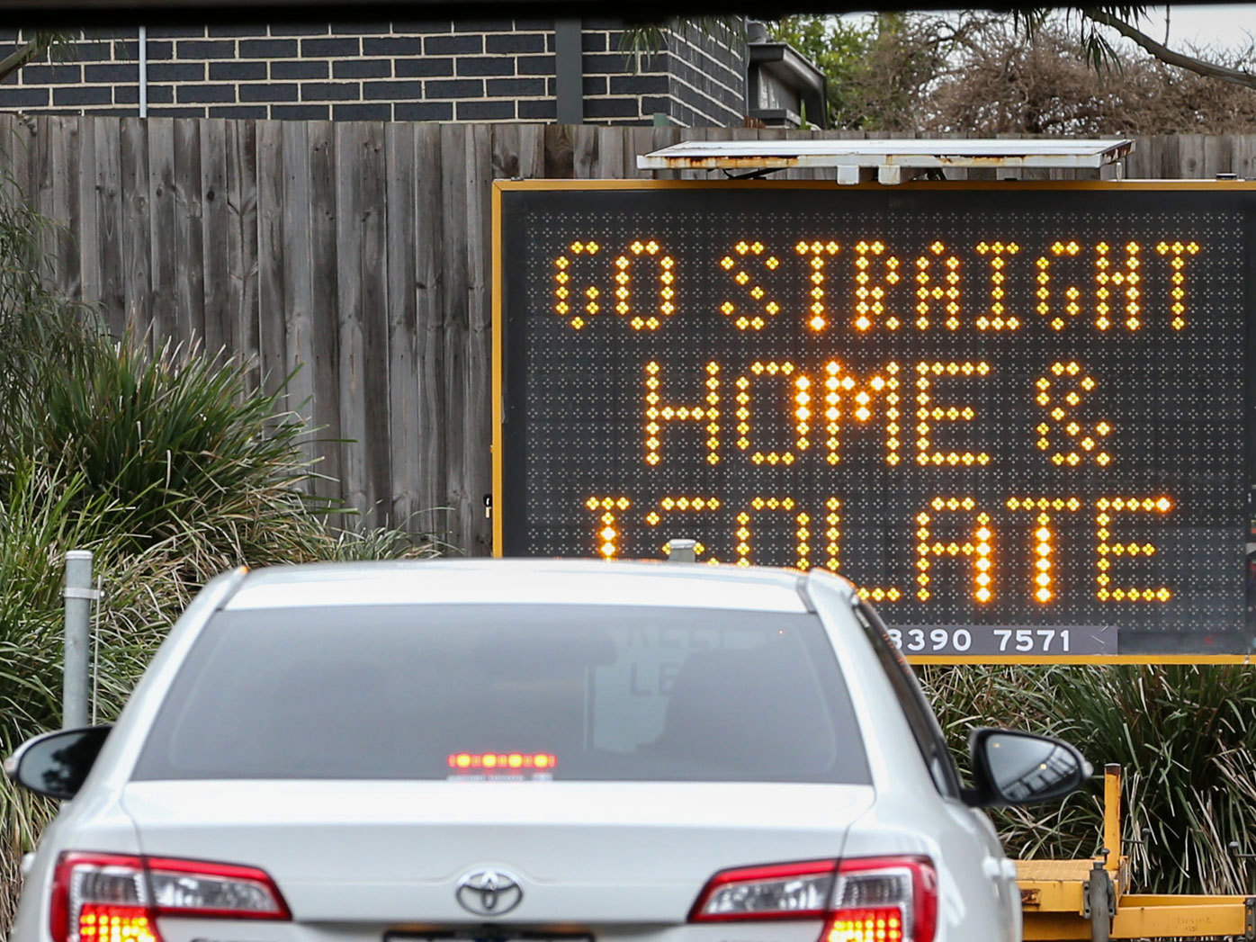 A car exiting a COVID-19 testing clinic in Melbourne.