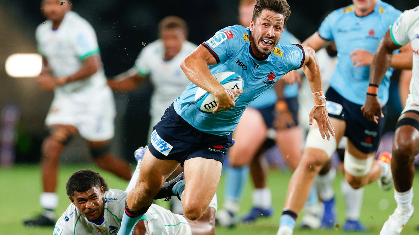 Jake Gordon of Waratahs makes a break 