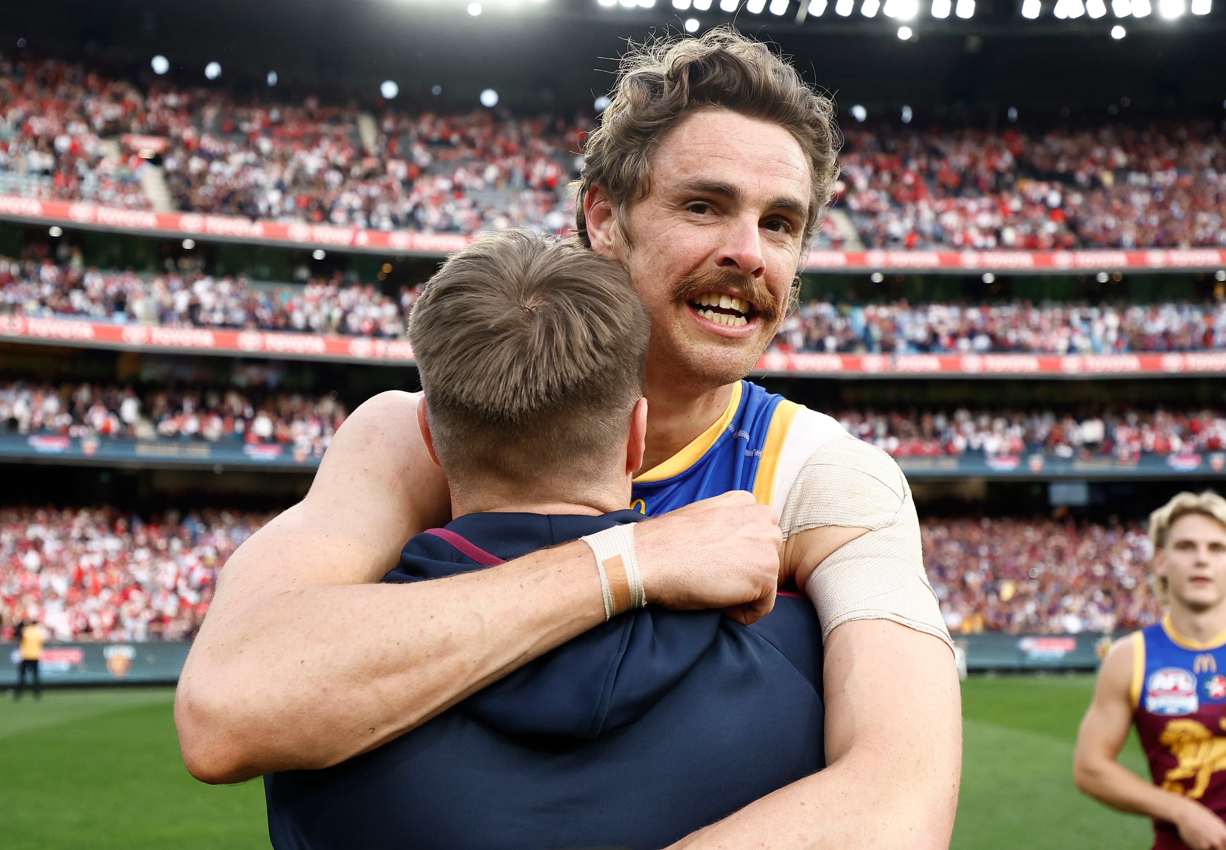 Lincoln McCarthy (left) and Joe Daniher of the Lions celebrate during the 2024 AFL Grand Final match between the Sydney Swans and the Brisbane Lions at The Melbourne Cricket Ground on September 28, 2024 in Melbourne, Australia. (Photo by Michael Willson/AFL Photos via Getty Images)