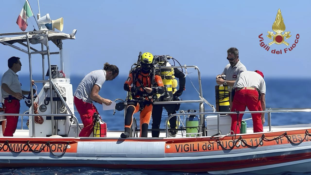 A firefighter cave diver as he prepares to reach the wrecked luxury superyacht Bayesian that sunk early Monday off the Sicilian coast in Porticciolo, in southern Italy on Friday, Aug. 23, 2024