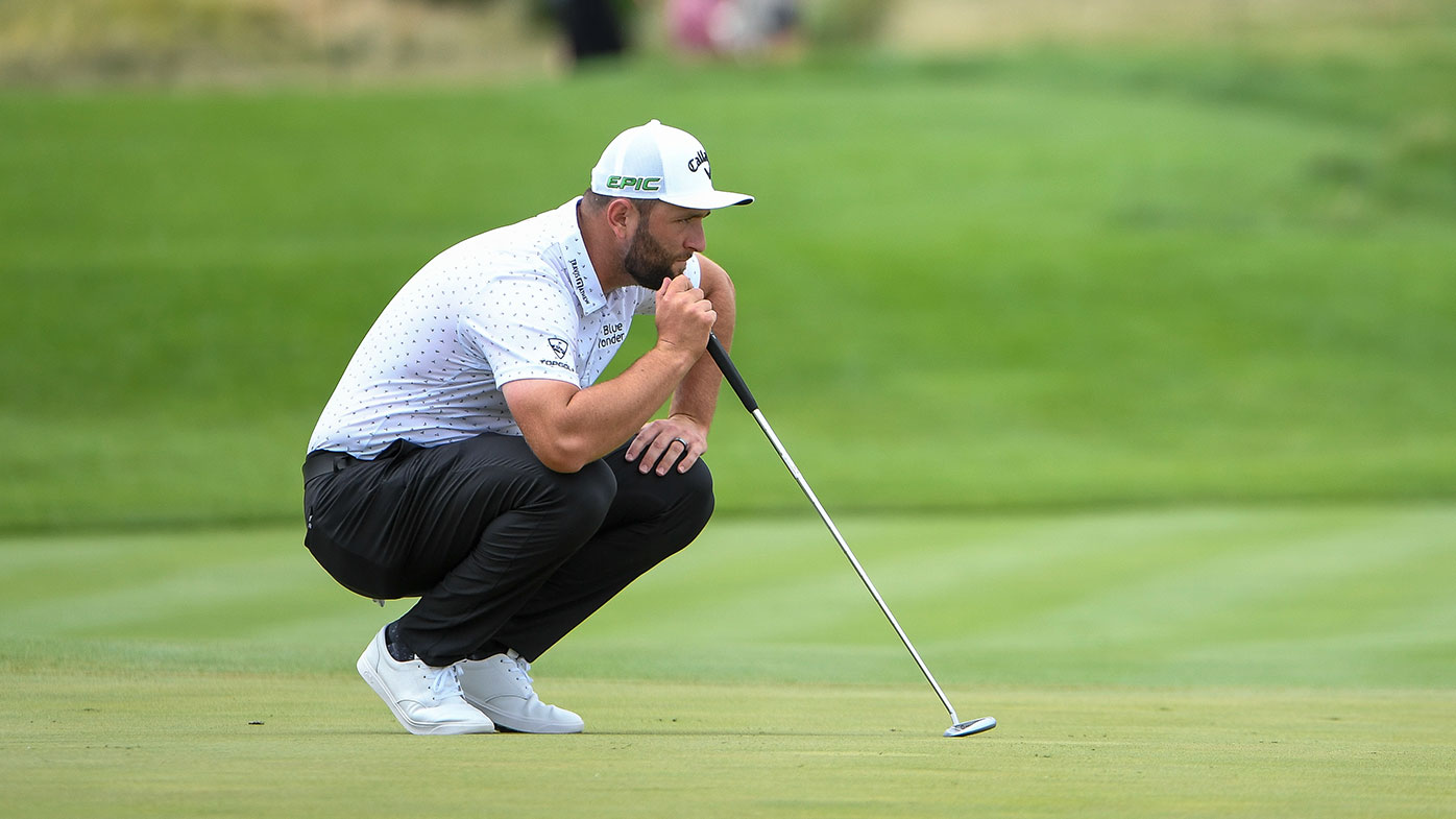 Jon Rahm of Spain looks over his putt at the second green during the third round of THE NORTHERN TRUST at Liberty National Golf Club on August 21, 2021 in Jersey City, New Jersey. (Photo by Tracy Wilcox/PGA TOUR via Getty Images)