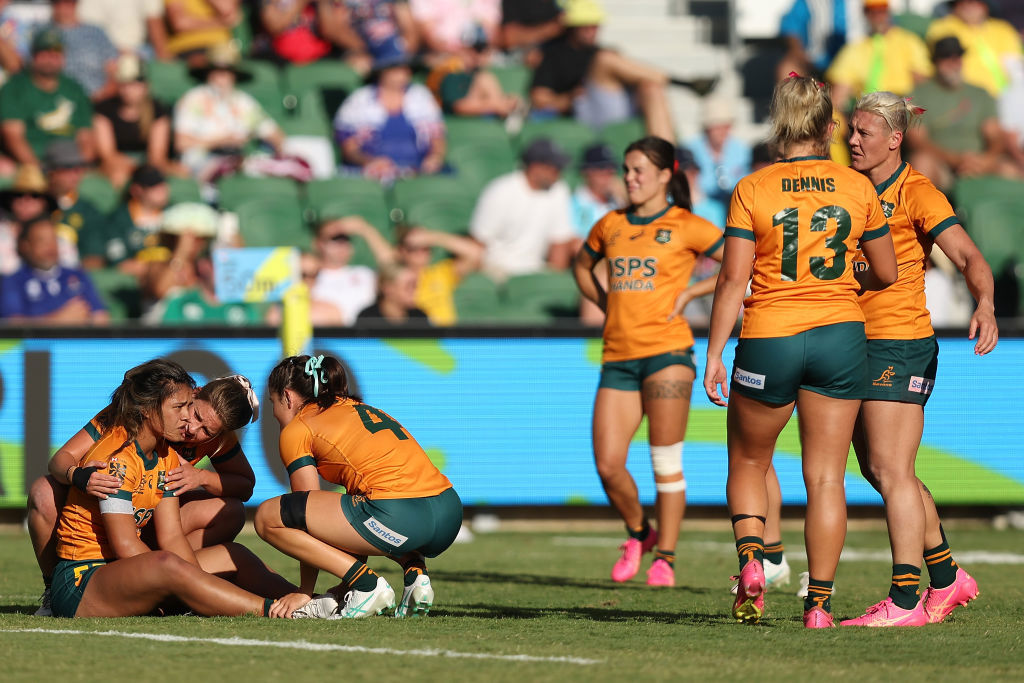 Australian players react after being defeated.
