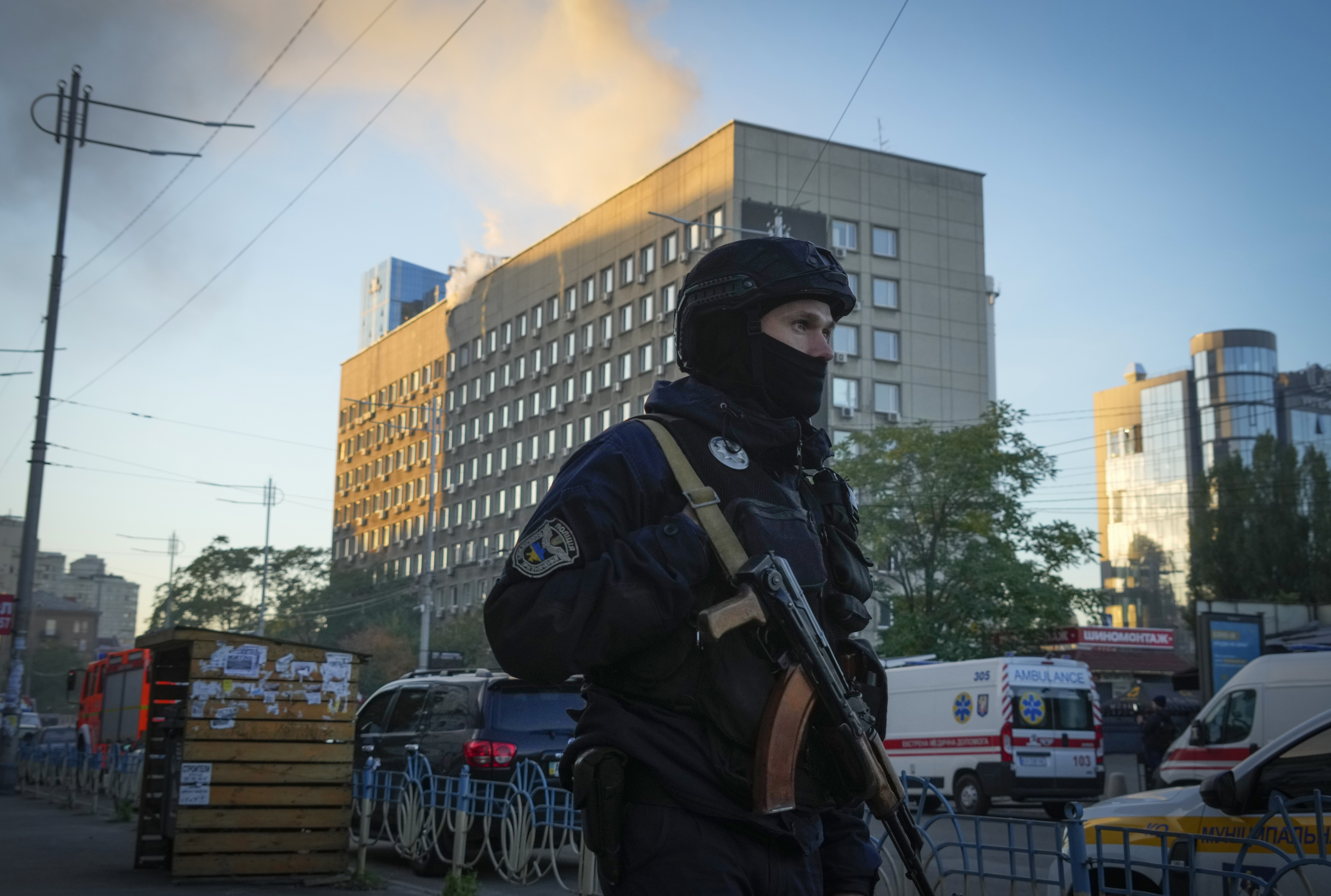 Police block the perimeter at the scene of Russian shelling in Kyiv on Monday, October 17.