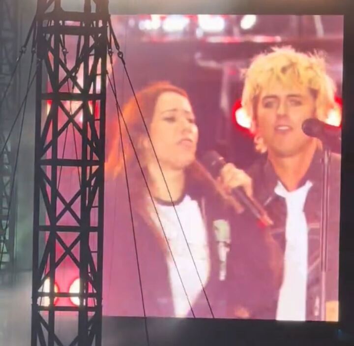 Shock moment Green Day fan grabs the microphone out of Billie Joel Armstrong's hands during Sydney show